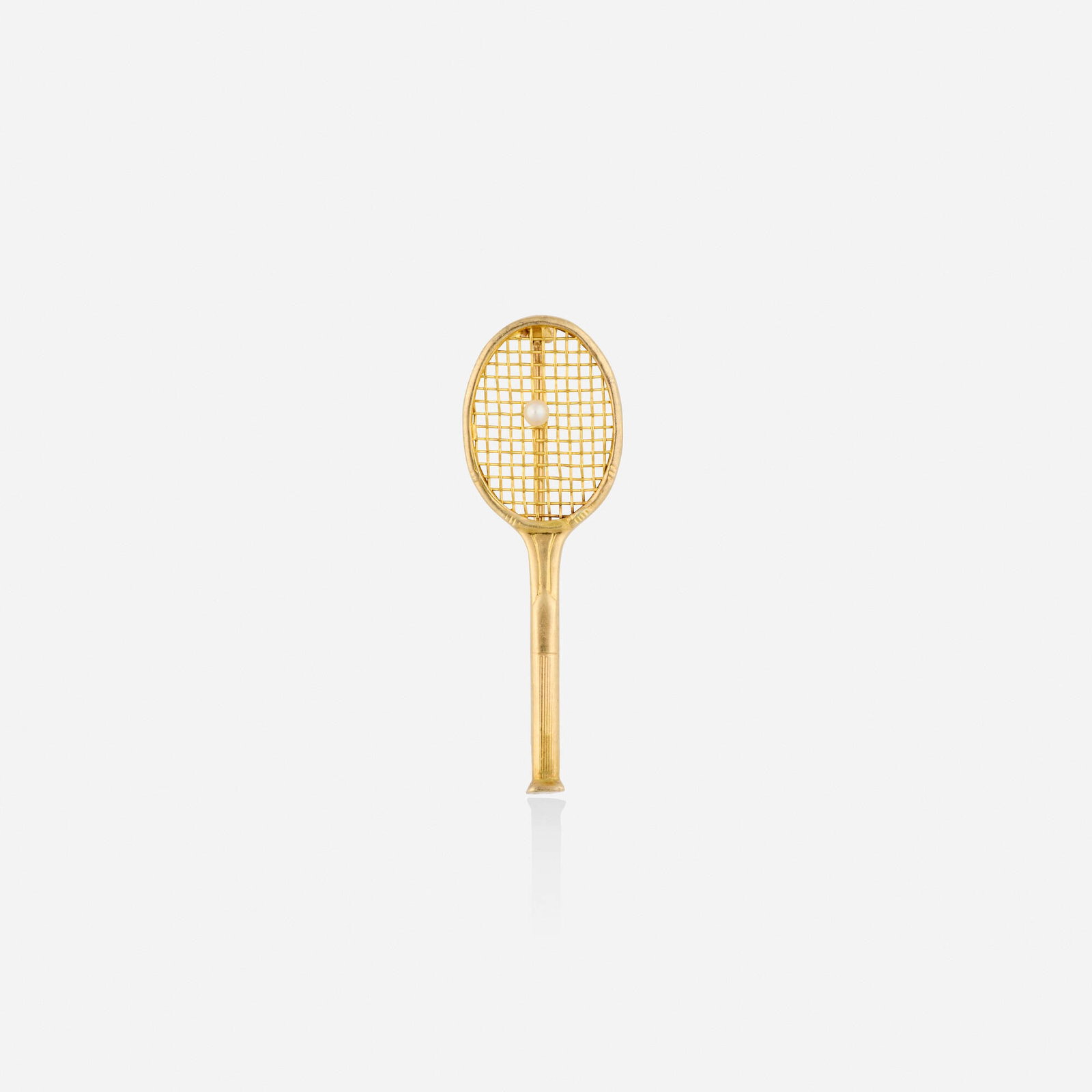 Tiffany & Co., Seed pearl and gold brooch: Tiffany & Co. Seed pearl and gold brooch The tennis racket set with a seed pearl 14k yellow gold Signed Tiffany & Co. 1.625 x 0.50 in; Gross weight 1.6 dwts Sold with signed box and pouch
