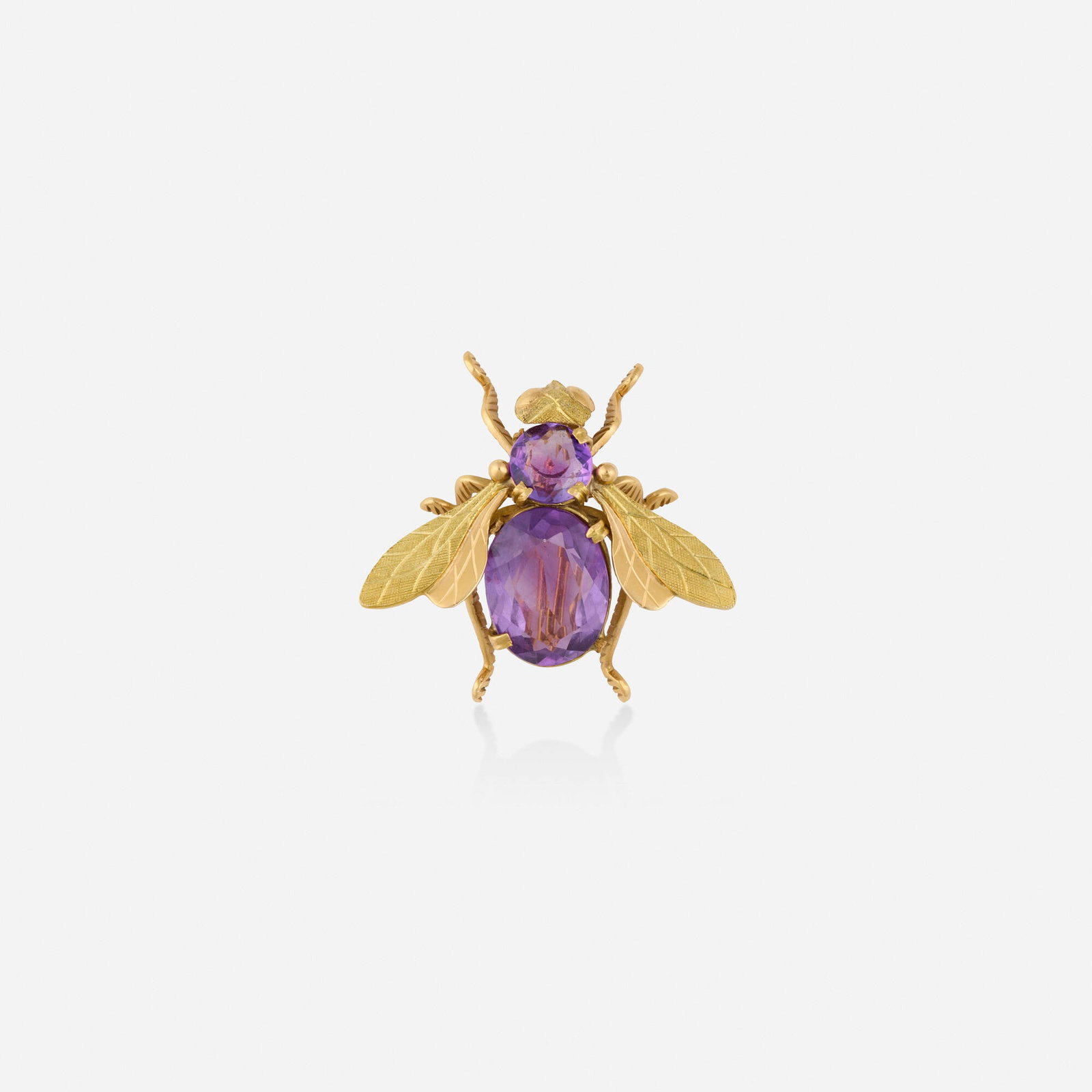 Amethyst and bicolor gold brooch: Amethyst and bicolor gold brooch The bee with circular and oval-cut amethyst body and bicolor gold wings 18k yellow and pink gold 1.375 x 1.25 in; Gross weight 7.2 dwts This work will ship from Lamber