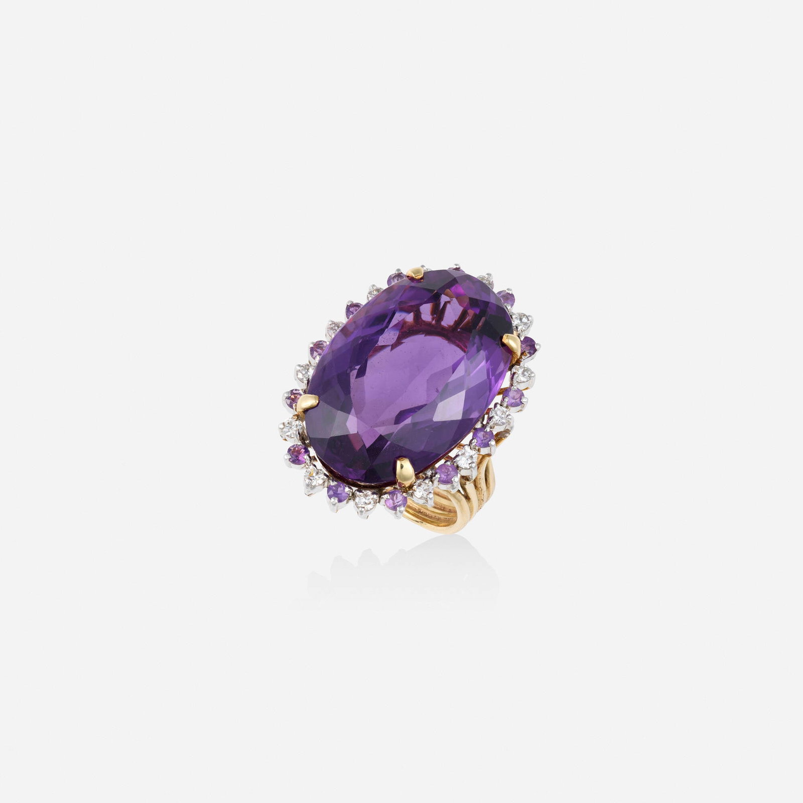 Amethyst, diamond, and gold ring: Amethyst, diamond, and gold ring Lori Ulanova was one of the first female violinists in the Los Angeles Philharmonic Set with an oval-cut amethyst, framed by round brilliant-cut diamonds and circular-