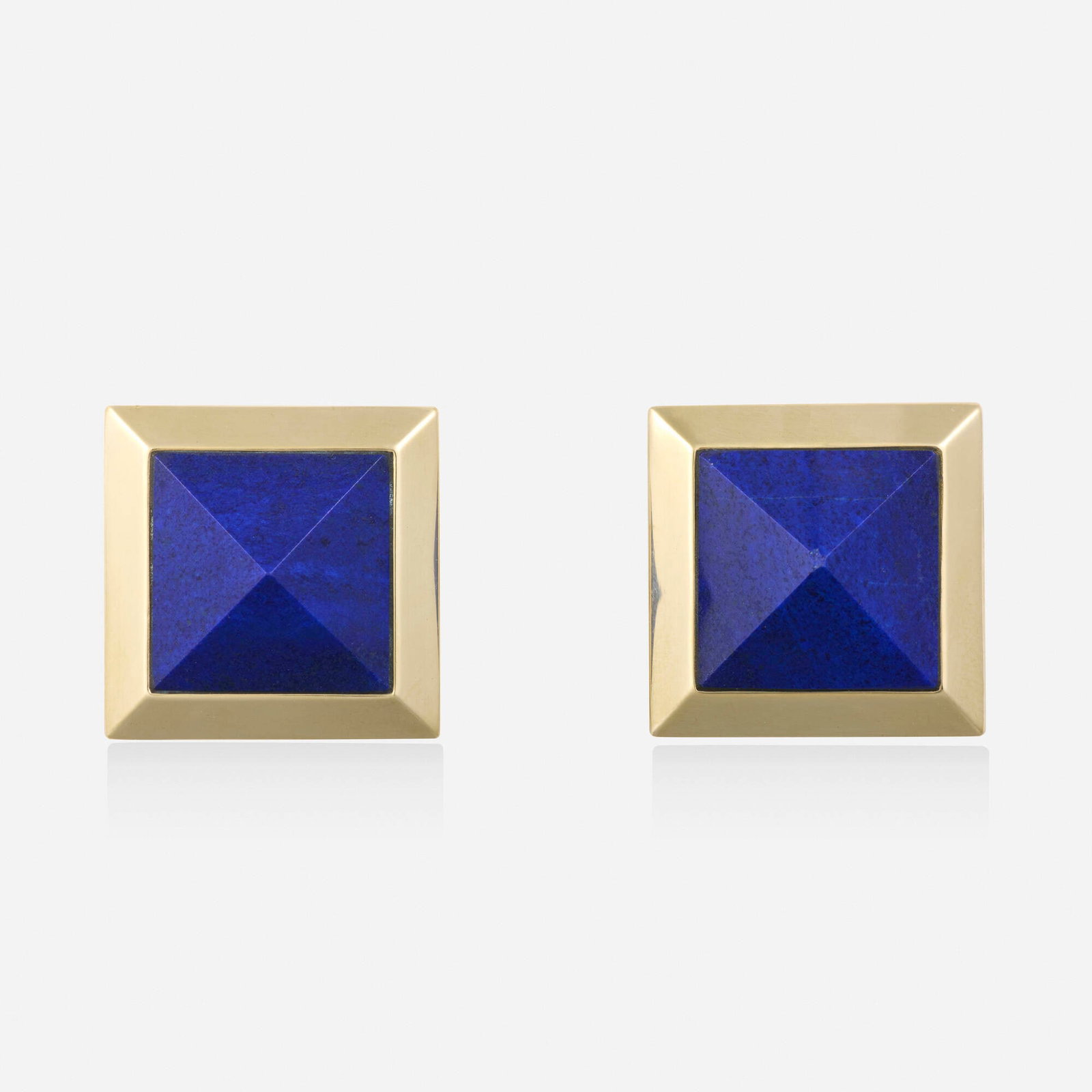 Paul Morelli, Lapis lazuli and gold earrings: Paul Morelli Lapis lazuli and gold earrings Each set with a pyramidal-cut lapis lazuli 14k yellow gold Signed Morelli 0.875 x 0.875 in; Gross weight 10.0 dwts This work will sh