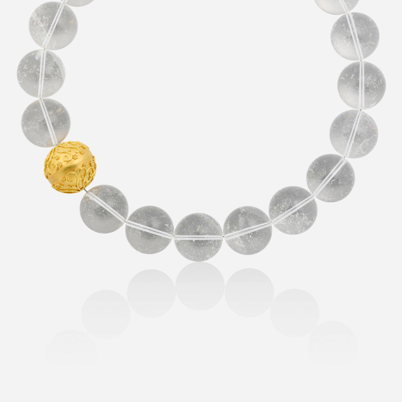 Rock crystal and gold necklace: Rock crystal and gold necklace Strung with rock crystal beads and one gold bead with wirework and granulation Yellow gold, base metal 17 in; Gross weight 157.3 dwts This work will ship from Lambertvil