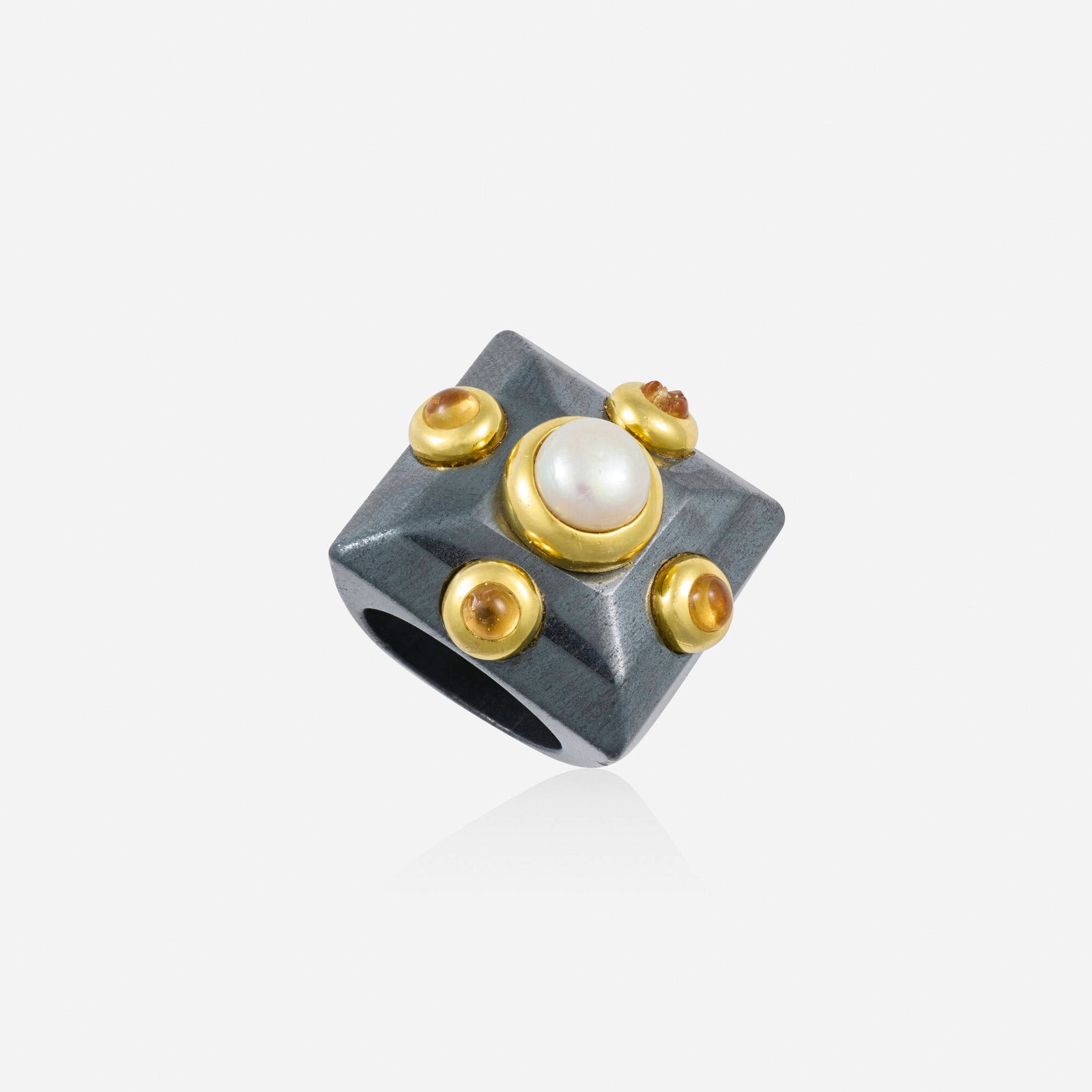 Multi-gem and gold ring: Multi-gem and gold ring The carved band of hematite, set with a cultured pearl and cabochon citrine 18k yellow gold Ring size 6-6.25; Gross weight 23.7 dwts This work will ship from Lambertville, New 