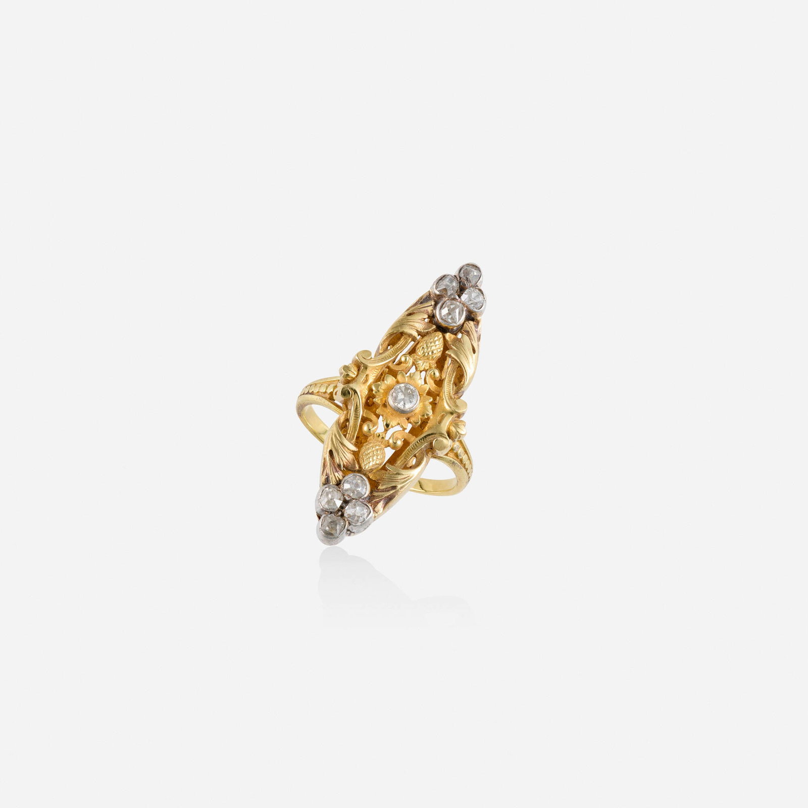 Diamond, gold, and silver ring: Diamond, gold, and silver ring Lori Ulanova was one of the first female violinists in the Los Angeles Philharmonic Of foliate design, set with old mine and old European-cut diamonds Silver-topped yell