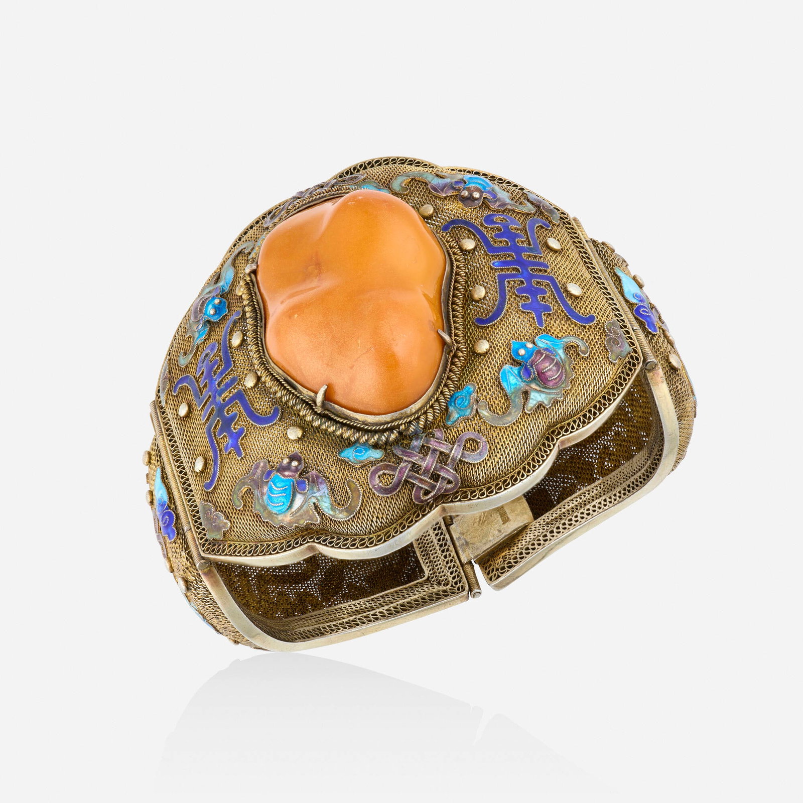 Chinese, Amber, enamel, and silver gilt bracelet: Chinese Amber, enamel, and silver gilt bracelet The mesh bracelet set with carved amber, surrounded by blue and purple enamel si bat motif decoration Silver gilt Inner circ. approx. 8 in, width 2.875 