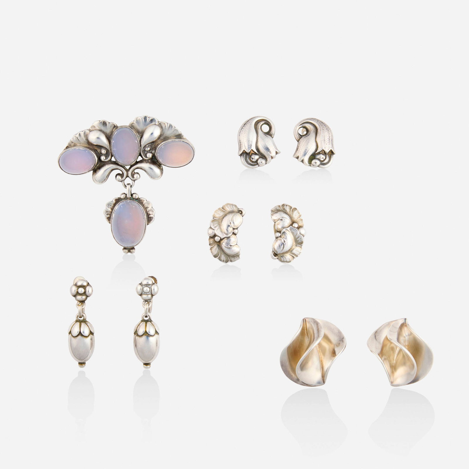 Georg Jensen, Group of sterling silver jewelry: Georg Jensen Group of sterling silver jewelry Lori Ulanova was one of the first female violinists in the Los Angeles Philharmonic Comprising a brooch set with cabochon moonstones, no. 152; a pair of t