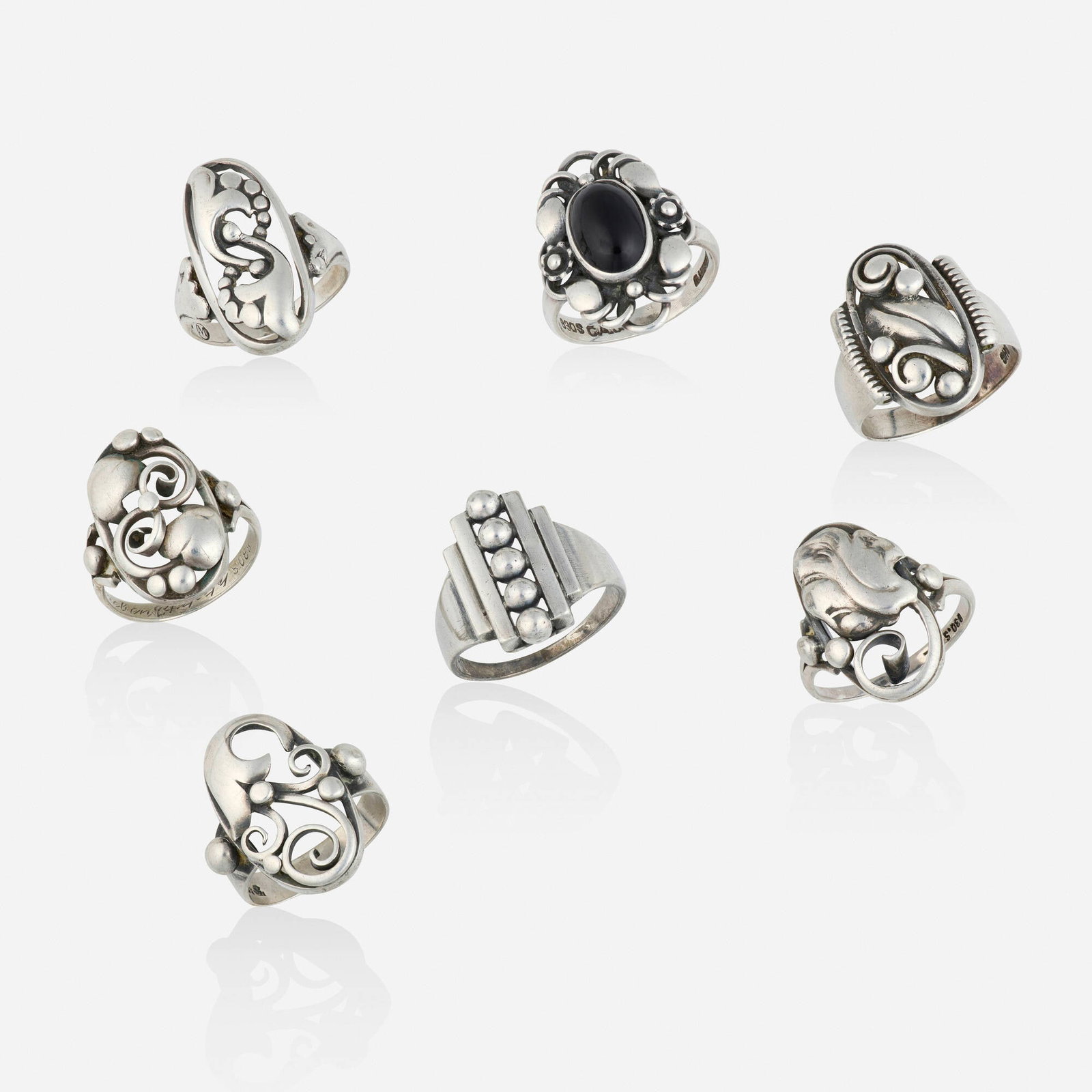 Group of silver rings: Group of silver rings Lori Ulanova was one of the first female violinists in the Los Angeles Philharmonic Comprising seven rings; one of floral design set with a cabochon black onyx by Carl A. Christe