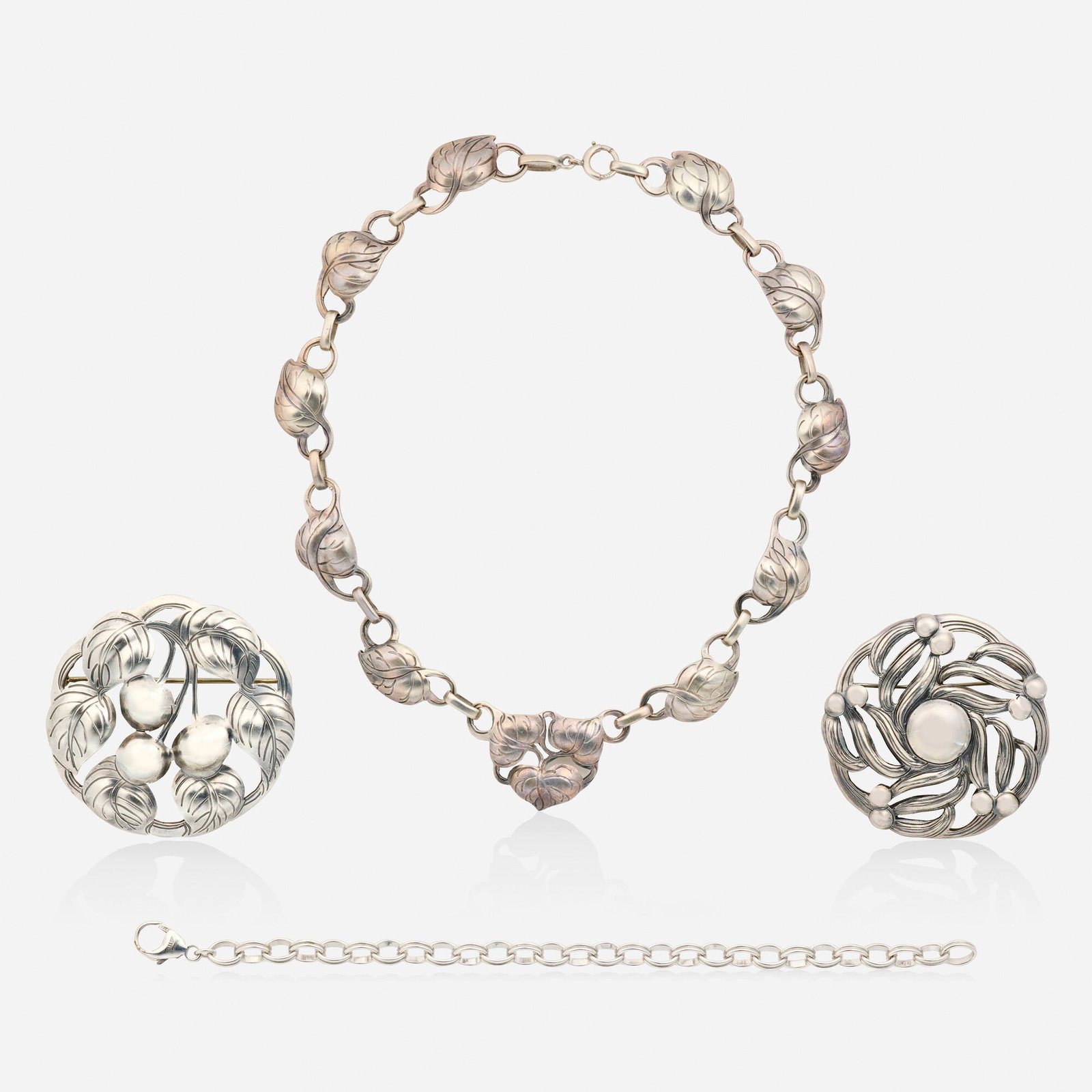 The Kalo Shop and Herco, Group of sterling silver jewelry: The Kalo Shop and Herco Group of sterling silver jewelry Comprising a foliate brooch, a cherry brooch, and a leaf necklace by The Kalo Shop; together with an oval link bracelet by Herco Sterling silve