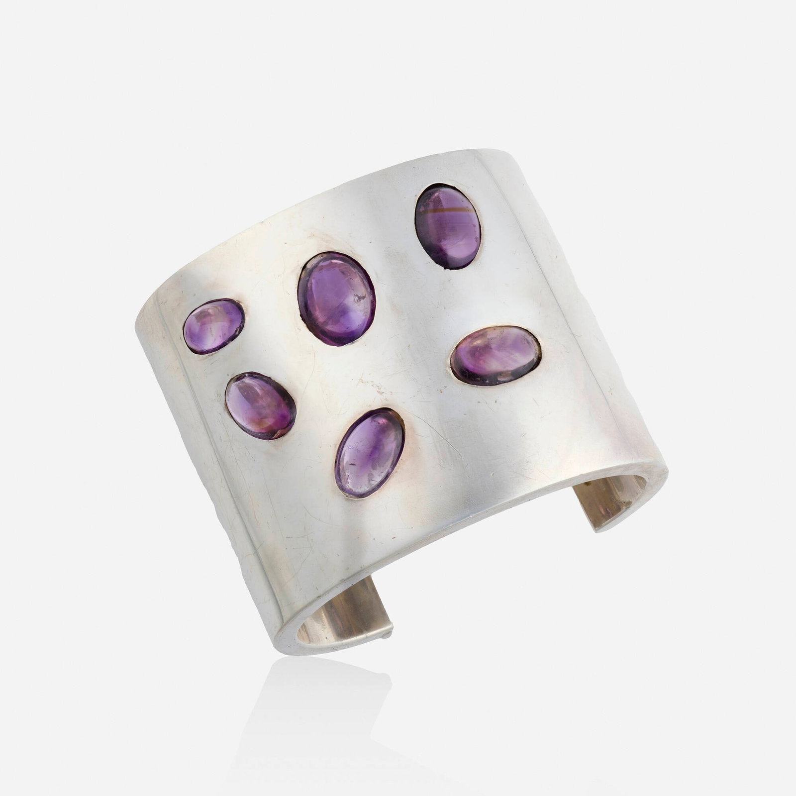 Antonio Pineda, Amethyst and sterling silver bracelet: Antonio Pineda Amethyst and sterling silver bracelet The cuff set with cabochon amethysts, no. ZZ774 Sterling silver Signed with maker's mark for Antonio Pineda Inner circ. 7 in, width 2.375