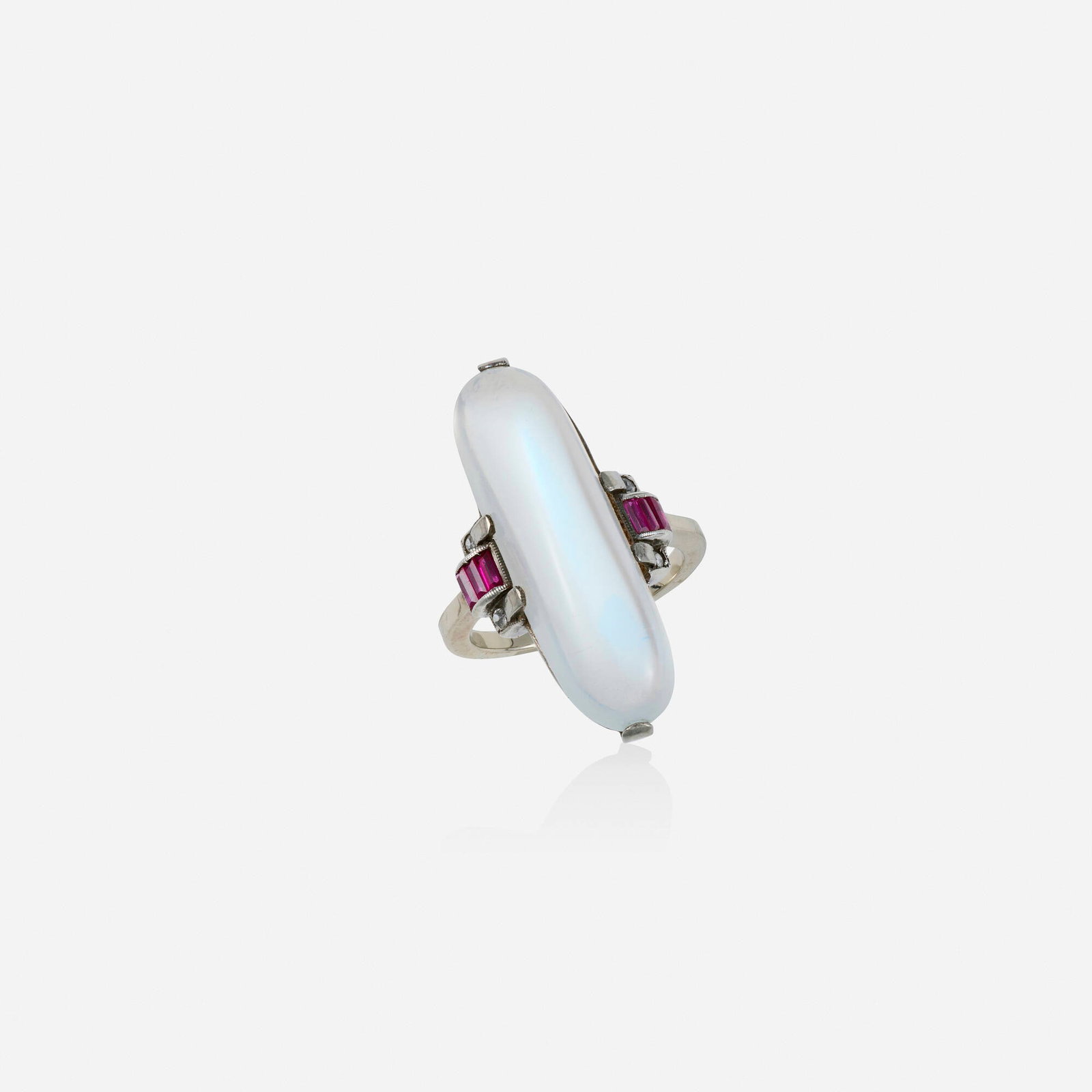 Moonstone, ruby, and diamond ring: Moonstone, ruby, and diamond ring Lori Ulanova was one of the first female violinists in the Los Angeles Philharmonic Set with a cabochon moonstone, flanked by rectangular-cut rubies and old mine-cut 