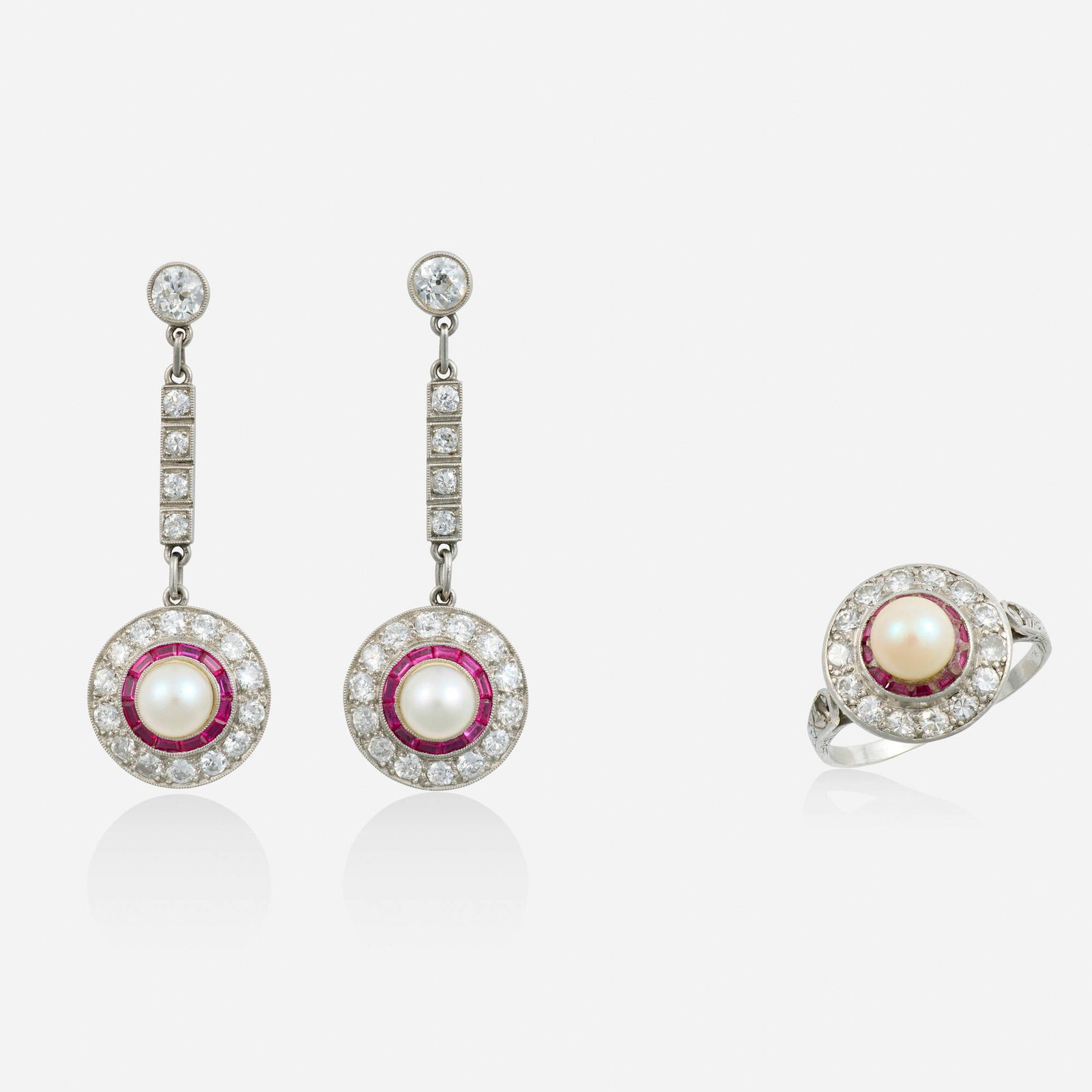 Cultured pearl, synthetic ruby, and diamond earrings and ring: Cultured pearl, synthetic ruby, and diamond earrings and ring Each set with a cultured pearl, framed by calibre-cut synthetic rubies and old European-cut diamonds Platinum, yellow gold Ring size 6, ea