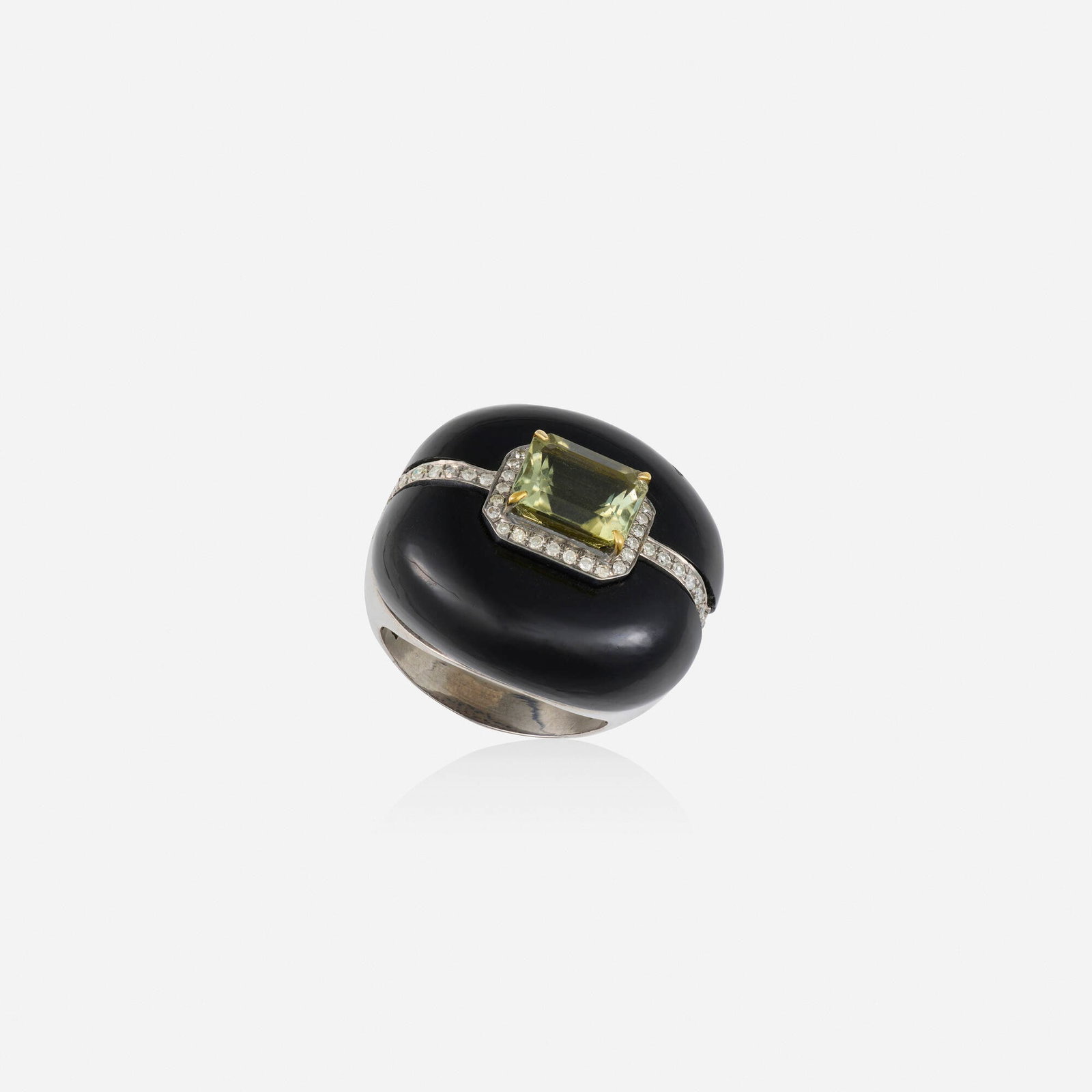 Black onyx, green tourmaline, and diamond ring: Black onyx, green tourmaline, and diamond ring Set with carved black onyx, an emerald-cut green tourmaline, and single-cut diamonds Silver, yellow gold Ring size 7.25; Gross weight 9.3 dwts This work 