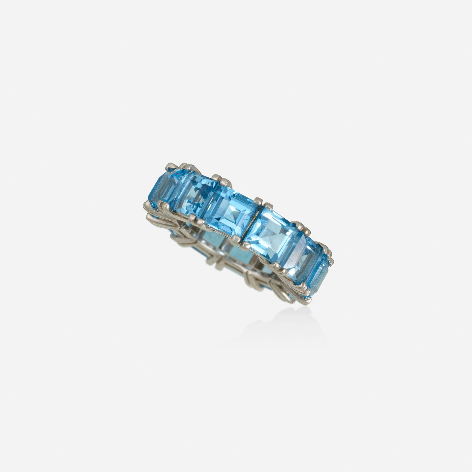 Blue topaz and white gold ring: Blue topaz and white gold ring Set with square-cut blue topaz White gold Ring size 6.50; Gross weight 7.3 dwts This work will ship from Lambertville, New Jersey.