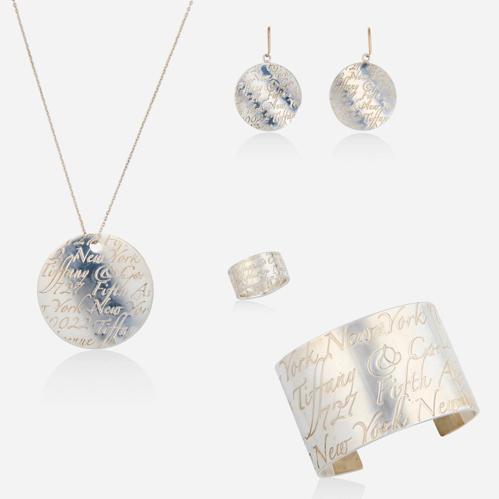 Tiffany & Co., Group of 'Notes' sterling silver jewelry: Tiffany & Co. Group of 'Notes' sterling silver jewelry Comprising a pendant necklace, cuff bracelet, pair of earrings, and ring each engraved 'Tiffany & Co. 727 Fifth Ave New York 10022' Ste