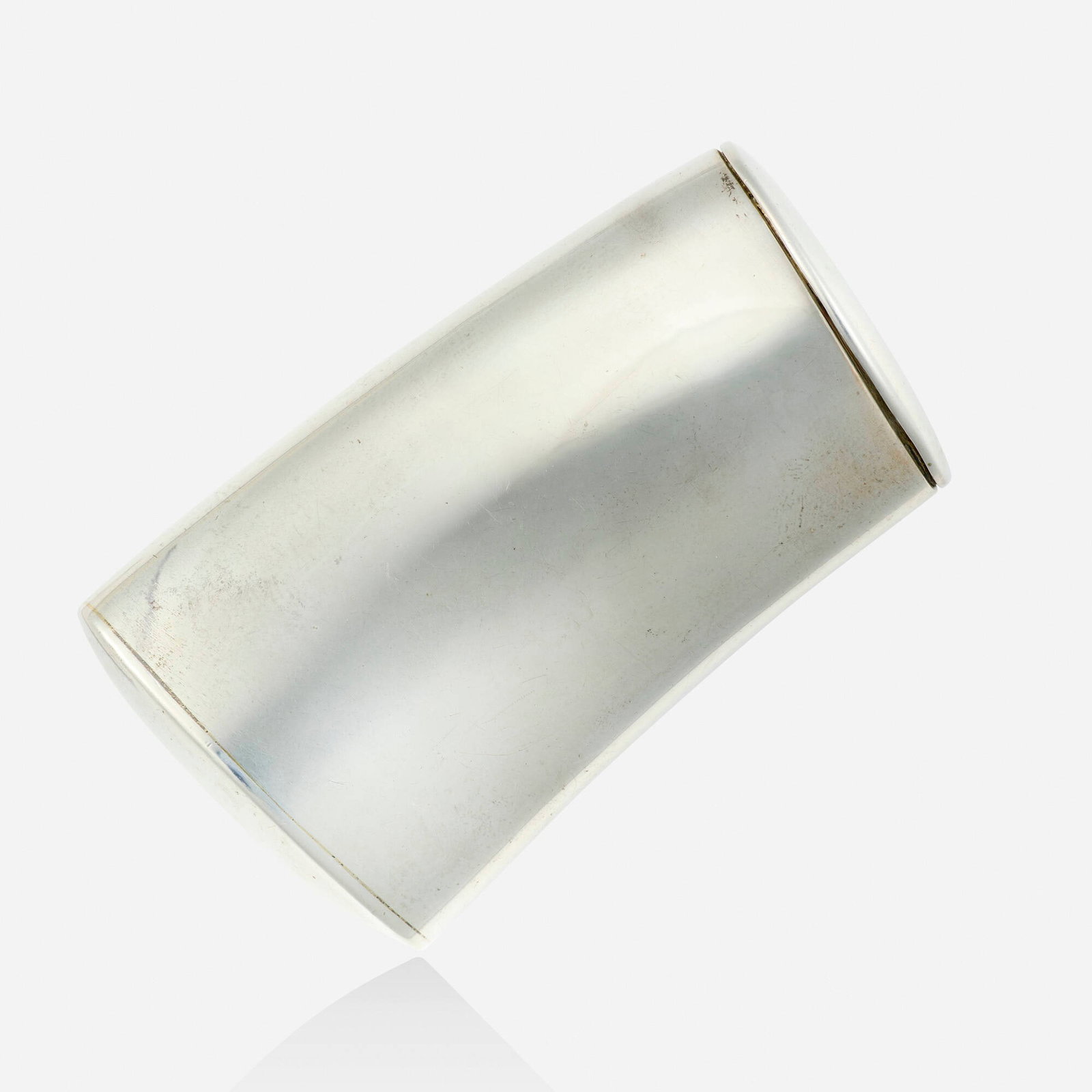 Ted Muehling, Silver box: Ted Muehling Silver box Of curved asymmetrical design, this unique piece is one-of-a-kind; 1987 Silver Signed T. Muehling 2.375 x 1.375 x 0.50 in; Gross weight 32.5 dwts This