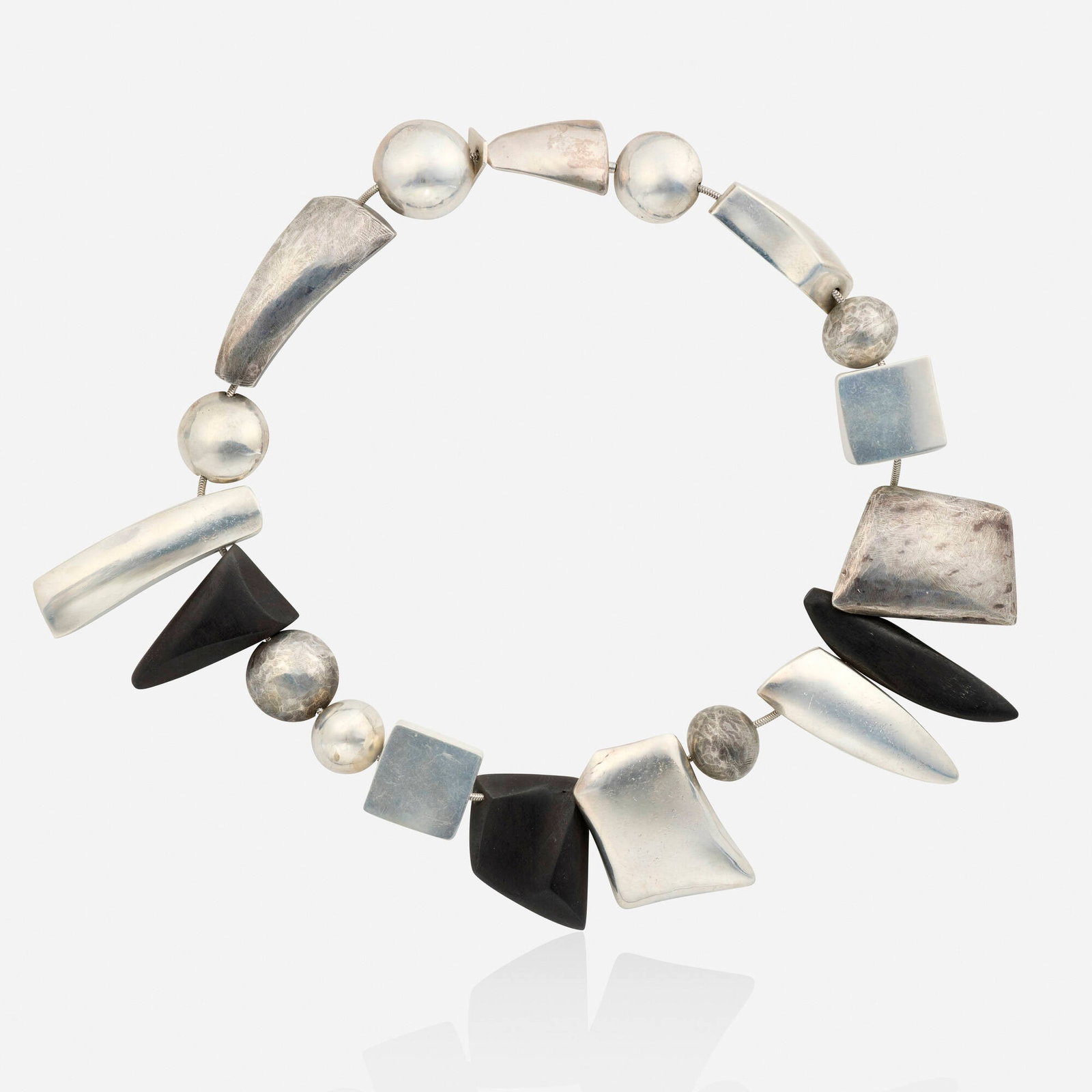 Sydney Lynch, Sterling silver and wood necklace: Sydney Lynch Sterling silver and wood necklace Of carved wood beads and variously-shaped hollow sterling silver beads Sterling silver Signed Sydney Lynch 18 in; Gross weight 88.9 dwts