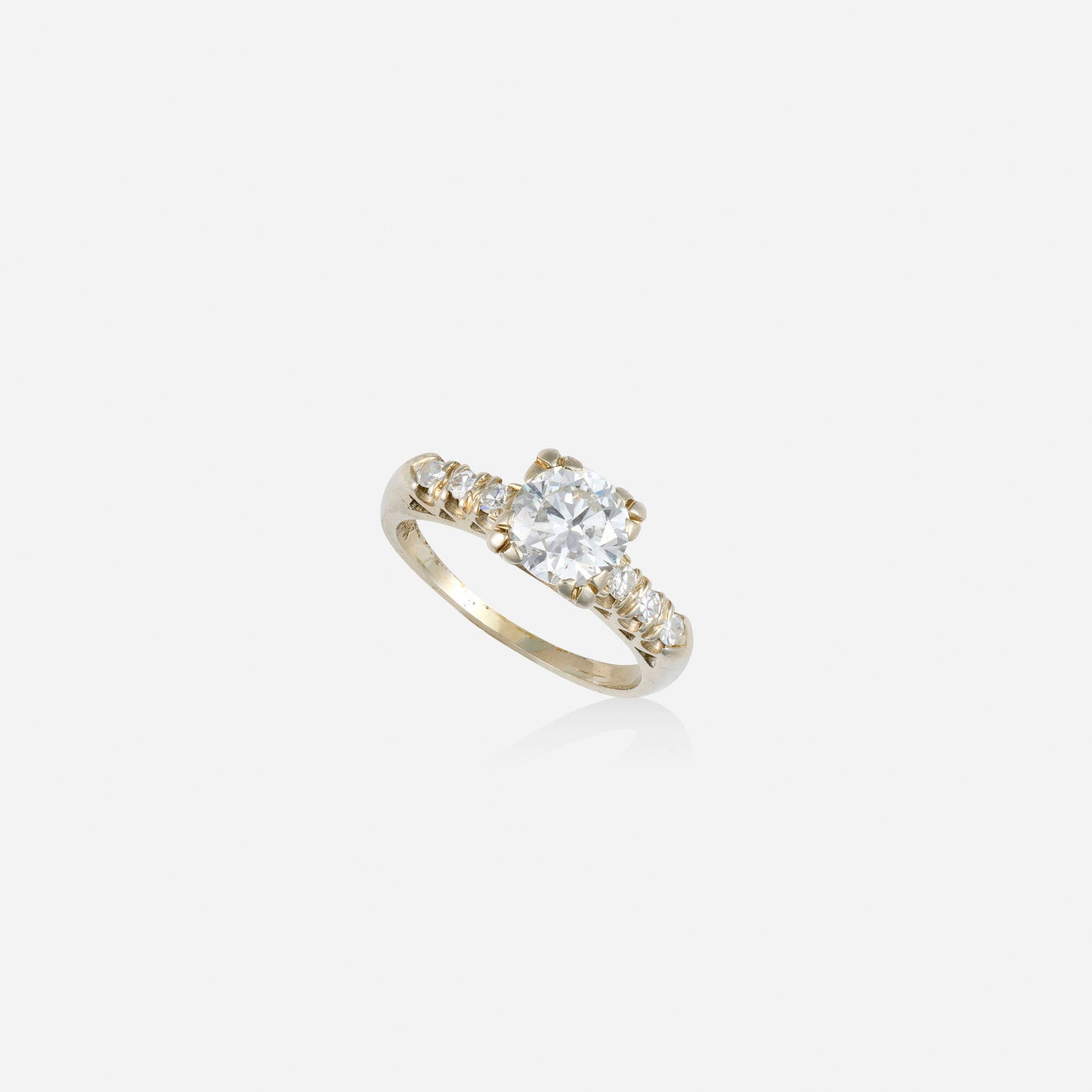 Diamond and white gold engagement ring: Diamond and white gold engagement ring Set with an old European-cut diamond, flanked by single-cut diamonds 14k white gold Ring size 5.25; Gross weight 1.9 dwts This work will ship from Lambertville, 