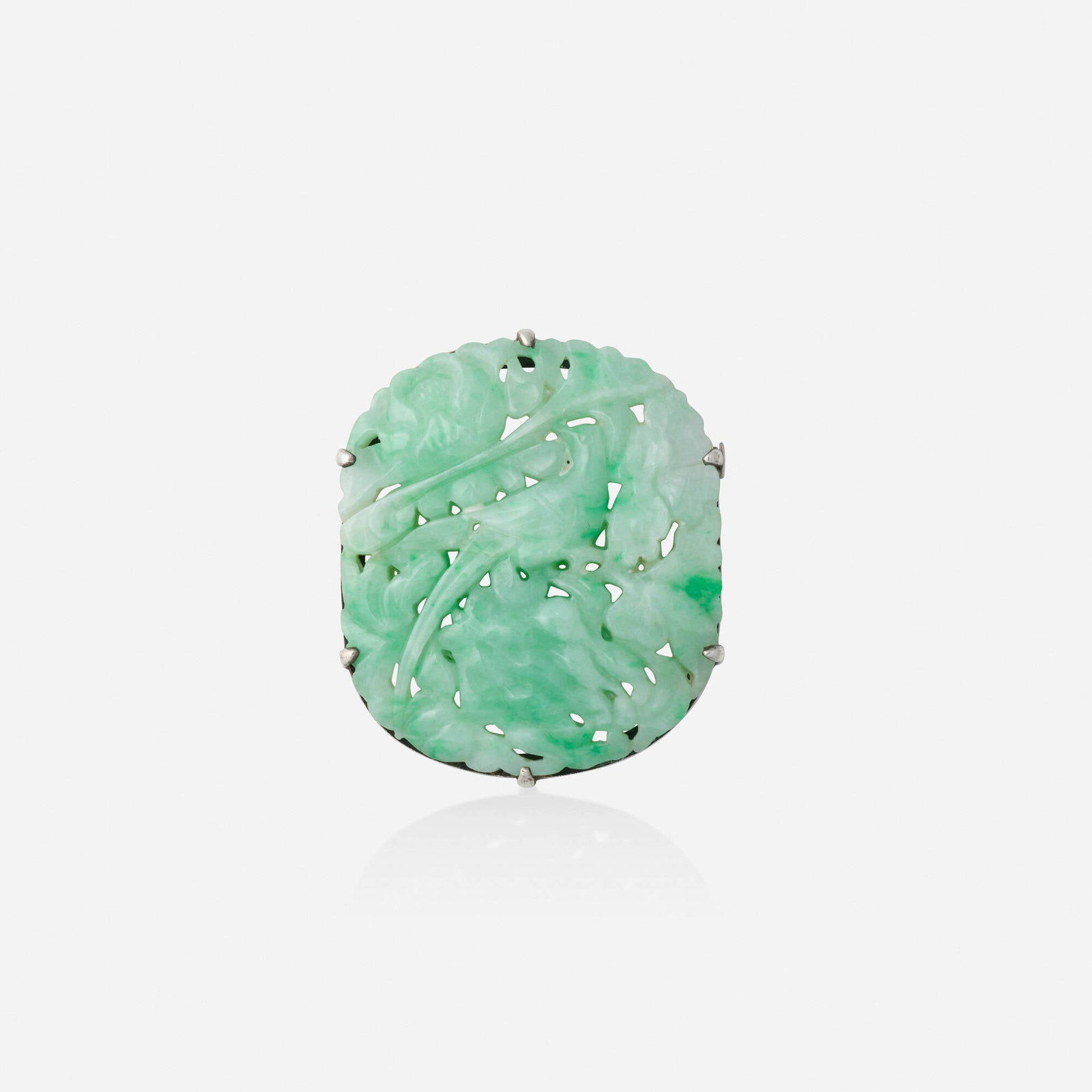 Jadeite and silver brooch: Jadeite and silver brooch Set with a carved jadeite plaque Silver 1.75 x 1.50 in; Gross weight 14.6 dwts This work will ship from Lambertville, New Jersey.