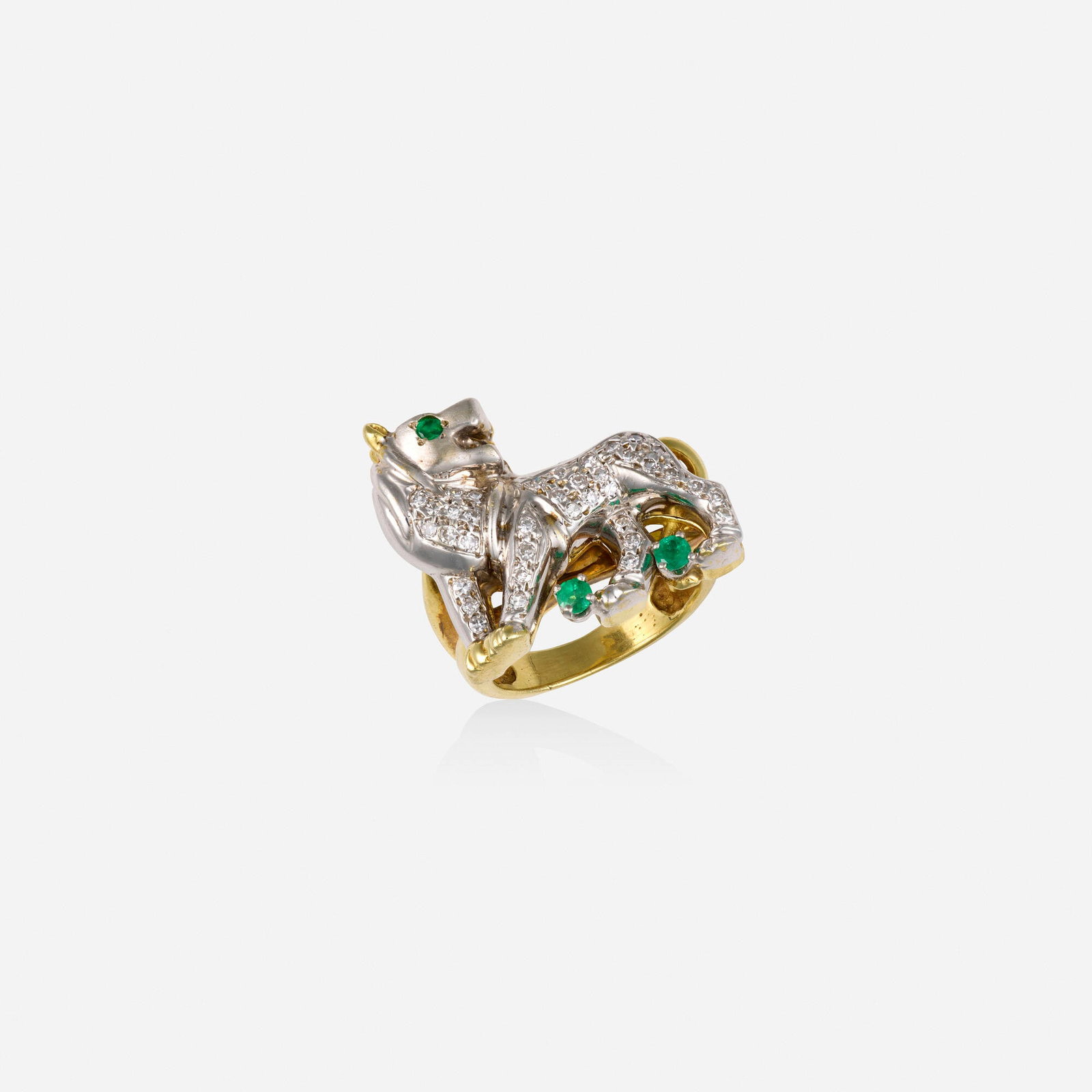 Maurice Katz, Diamond, emerald, and bicolor gold ring: Maurice Katz Diamond, emerald, and bicolor gold ring Designed as a lion set with single-cut diamonds and circular-cut emeralds 14k yellow and white gold Signed Maurice Katz Ring size 6; Gross weig
