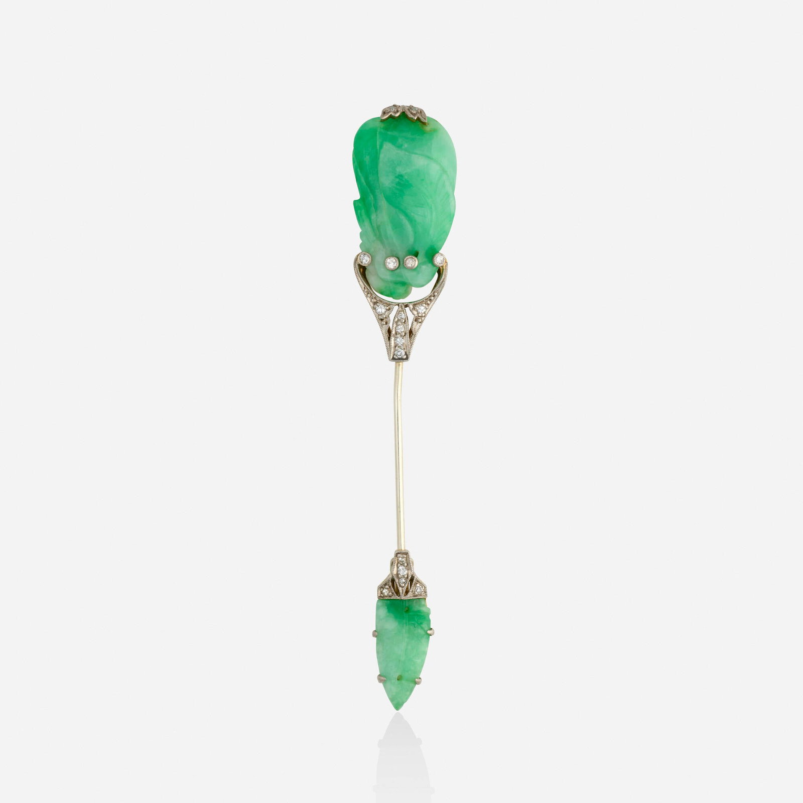 Jadeite, diamond, and bicolor gold jabot pin: Jadeite, diamond, and bicolor gold jabot pin Set with carved jadeite and single-cut diamonds Yellow and white gold 3.25 x 0.50 in; Gross weight 5.8 dwts This work will ship from Lambertville, New Jers