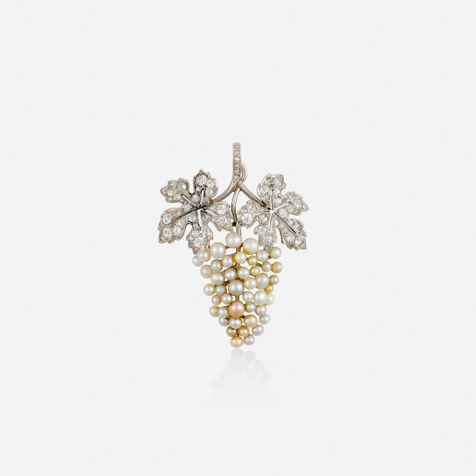 Seed pearl, diamond, and platinum pendant: Seed pearl, diamond, and platinum pendant Designed as a bunch of grapes and leaves, set with seed pearls, old mine and rose-cut diamonds Platinum 1.75 x 1.25 in; Gross weight 5.2 dwts This work will s