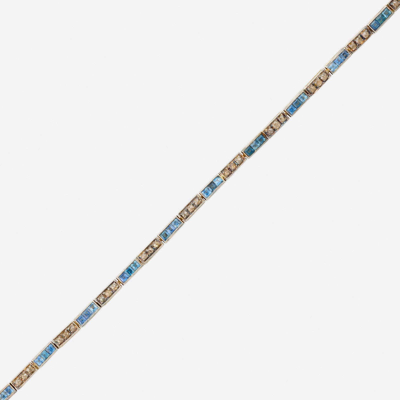 Aquamarine, diamond, and silver gilt bracelet: Aquamarine, diamond, and silver gilt bracelet Set with alternating square-cut aquamarine and rose-cut diamonds Sterling silver gilt, 14k yellow gold 7 x 0.125 in; Gross weight 6.1 dwts This work will 