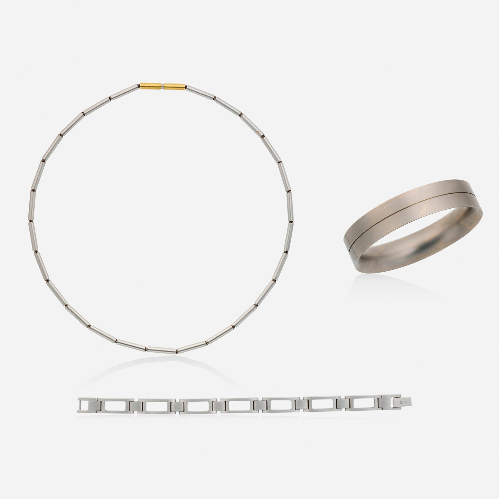 Carl Dau and Xen, Group of stainless steel and gold jewelry: Carl Dau and Xen Group of stainless steel and gold jewelry Comprising a tubular link necklace and bangle by Carl Dau; together with a rectangular link bracelet by Xen Stainless steel, yellow gold Sign