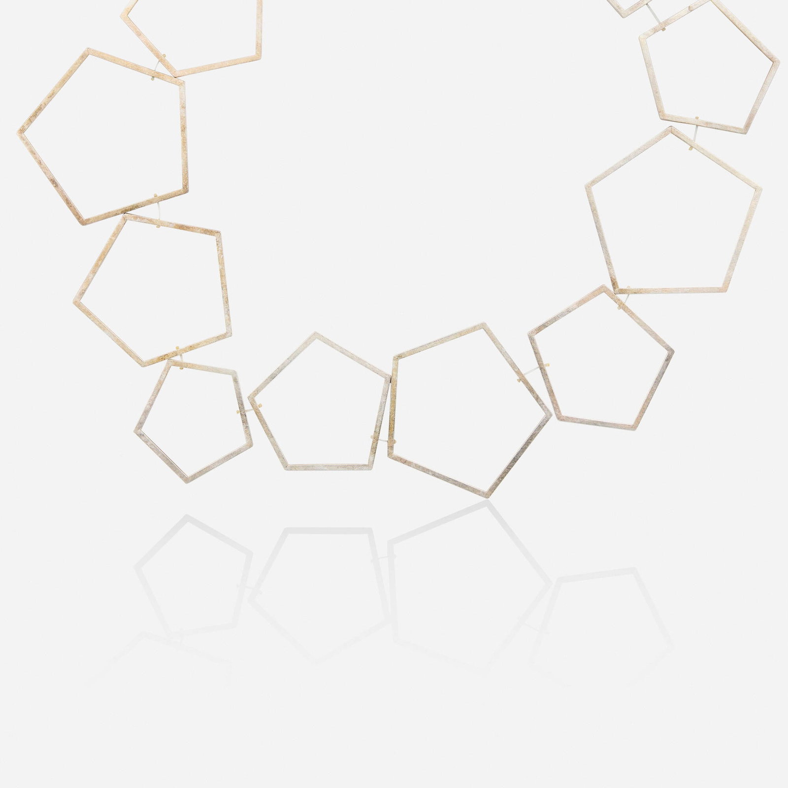 Sterling silver necklace: Sterling silver necklace Designed with open-form pentagon-shaped links Sterling silver 21.50 in; Gross weight 21.5 dwts This work will ship from Lambertville, New Jersey.