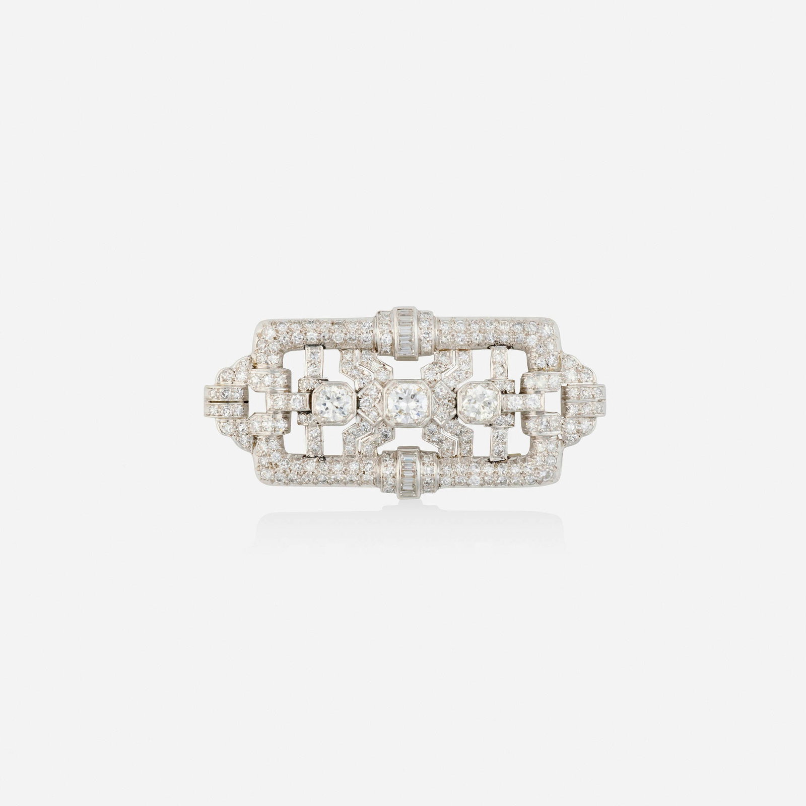 Diamond and platinum pendant brooch: Diamond and platinum pendant brooch Of open-form design, set with old European, single, and baguette-cut diamonds Platinum, 14k white gold 2.125 x 1 in; Gross weight 11.3 dwts This work will ship from