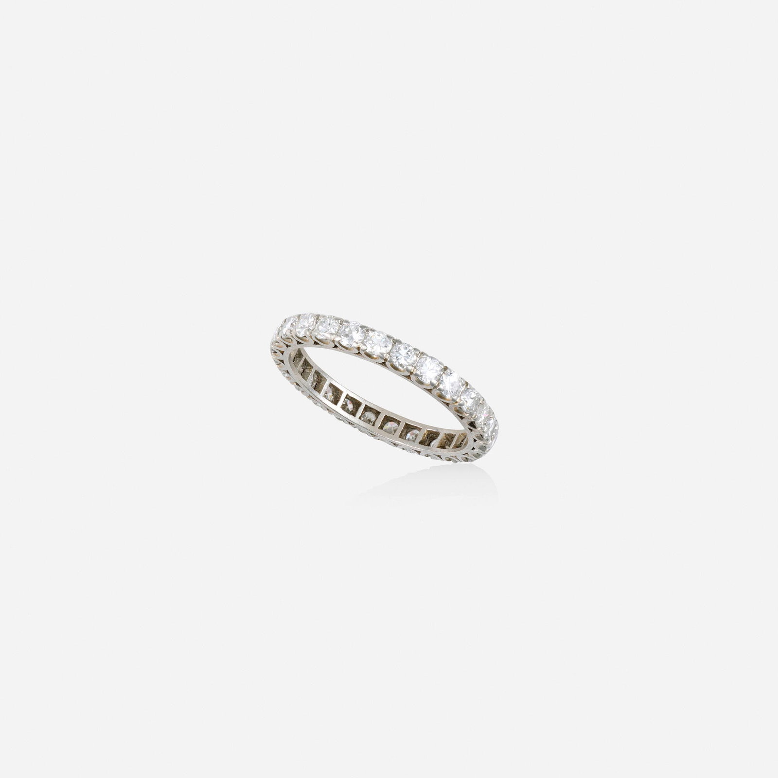 Diamond and platinum ring: Diamond and platinum ring Set with round brilliant-cut diamonds Platinum Ring size 6.50; Gross weight 1.7 dwts This work will ship from Lambertville, New Jersey.