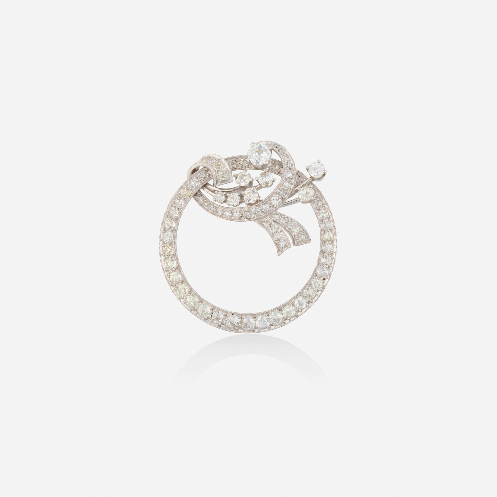 Diamond and platinum brooch: Diamond and platinum brooch Set with old European, old mine, and single-cut diamonds Platinum 1.375 in; Gross weight 7.7 dwts This work will ship from Lambertville, New Jersey.