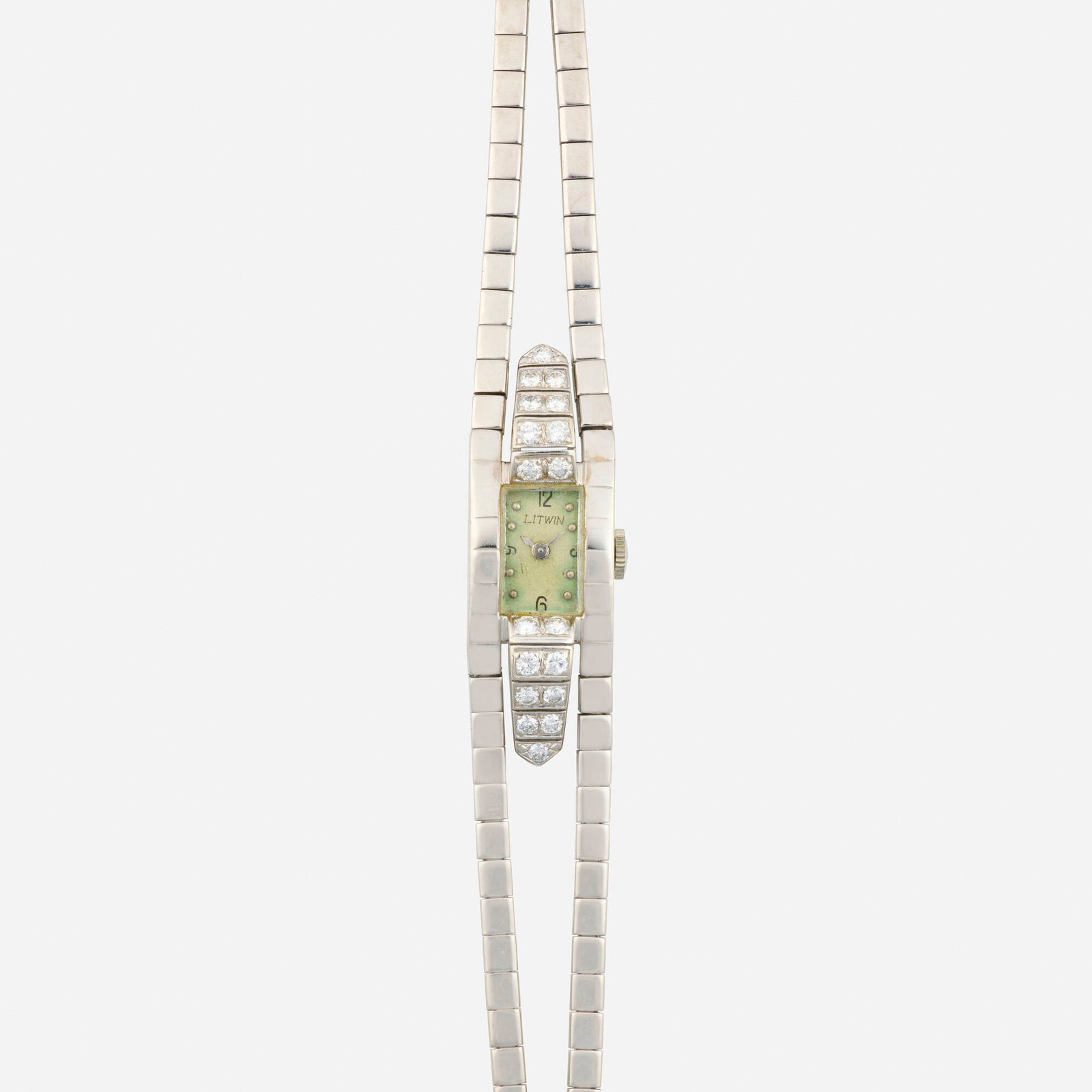 Diamond and white gold wristwatch: Diamond and white gold wristwatch With Arabic and dot hours, the case set with round brilliant-cut diamonds Dial: Silvered Movement: Manual wind Case Material: 14k white gold