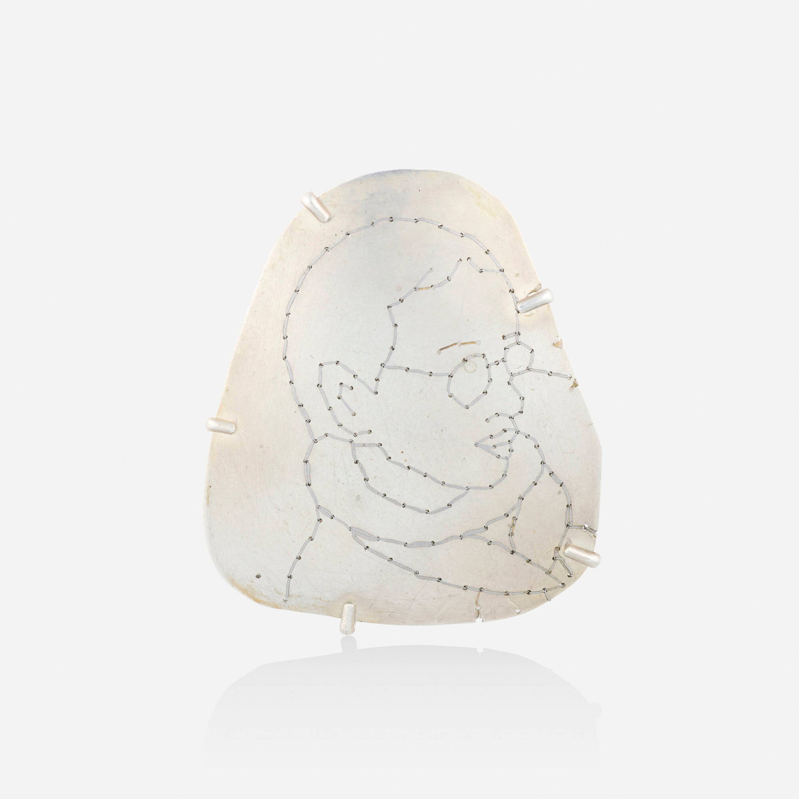 Esther Knobel, Silver and iron brooch: Esther Knobel Silver and iron brooch Depicting a profile, through perforated (drilled) drawing 'sewn' with iron wire; part of 'The Mind in the Hand' series Silver, iron 2.50 x