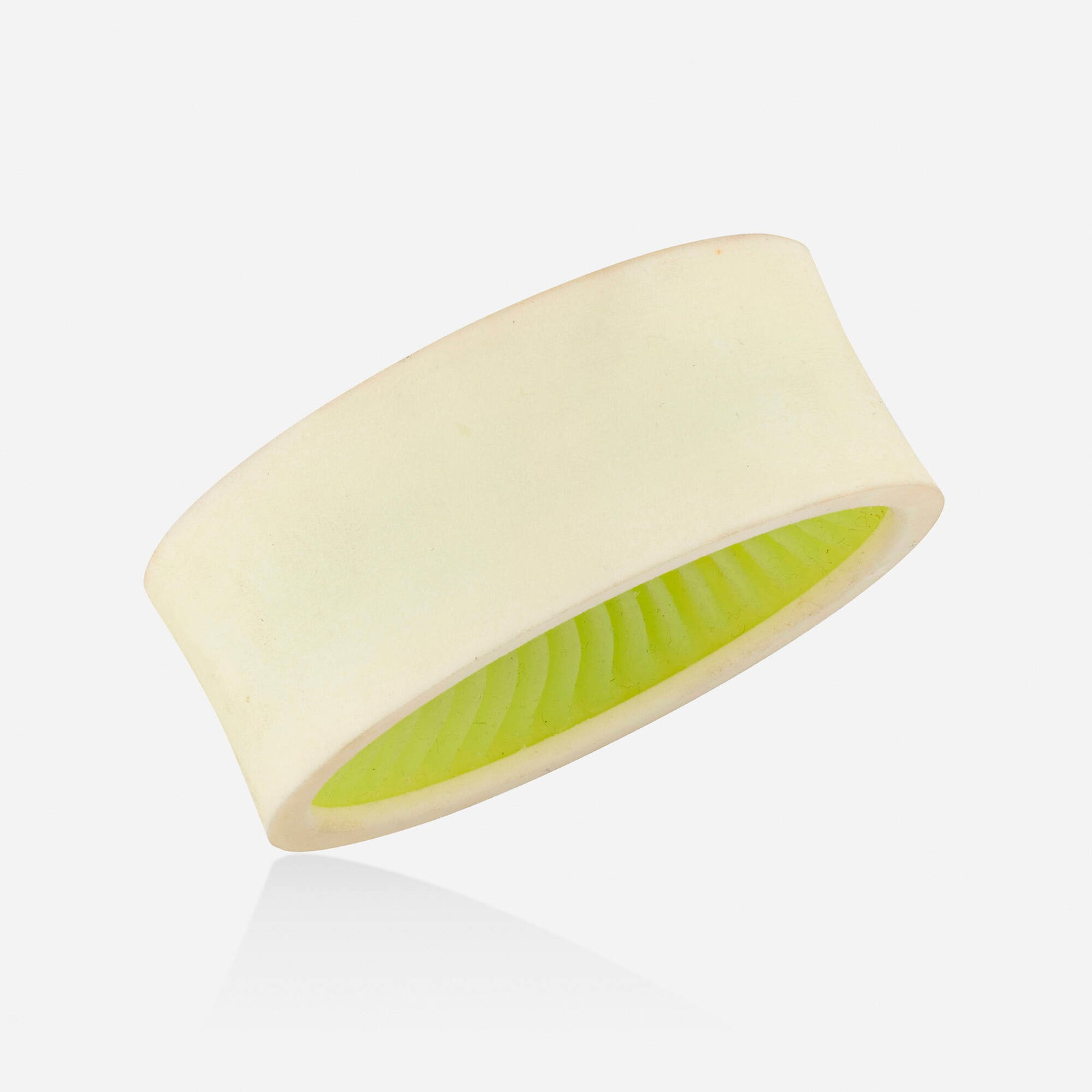 Bangle bracelet: Bangle bracelet The concave white bangle bracelet with lime green inner rubber lining Nylon, acrylic, rubber Inner circ. approx. 6.25 in, width 1.25 in; Gross weight 47.4 dwts Provenance: Collection o