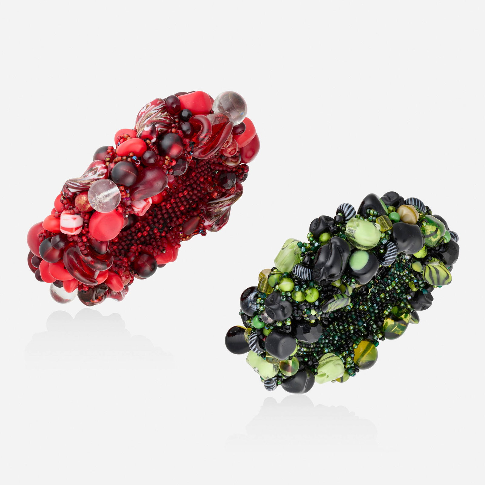 Judy Onofrio, Two green and red bead bracelets: Judy Onofrio Two green and red bead bracelets Each designed with woven beads Inner circ. 7.50 in and 7 in, width 0.25 in; Gross weight 223.0 dwts Provenance: Collection of Mari Shaw