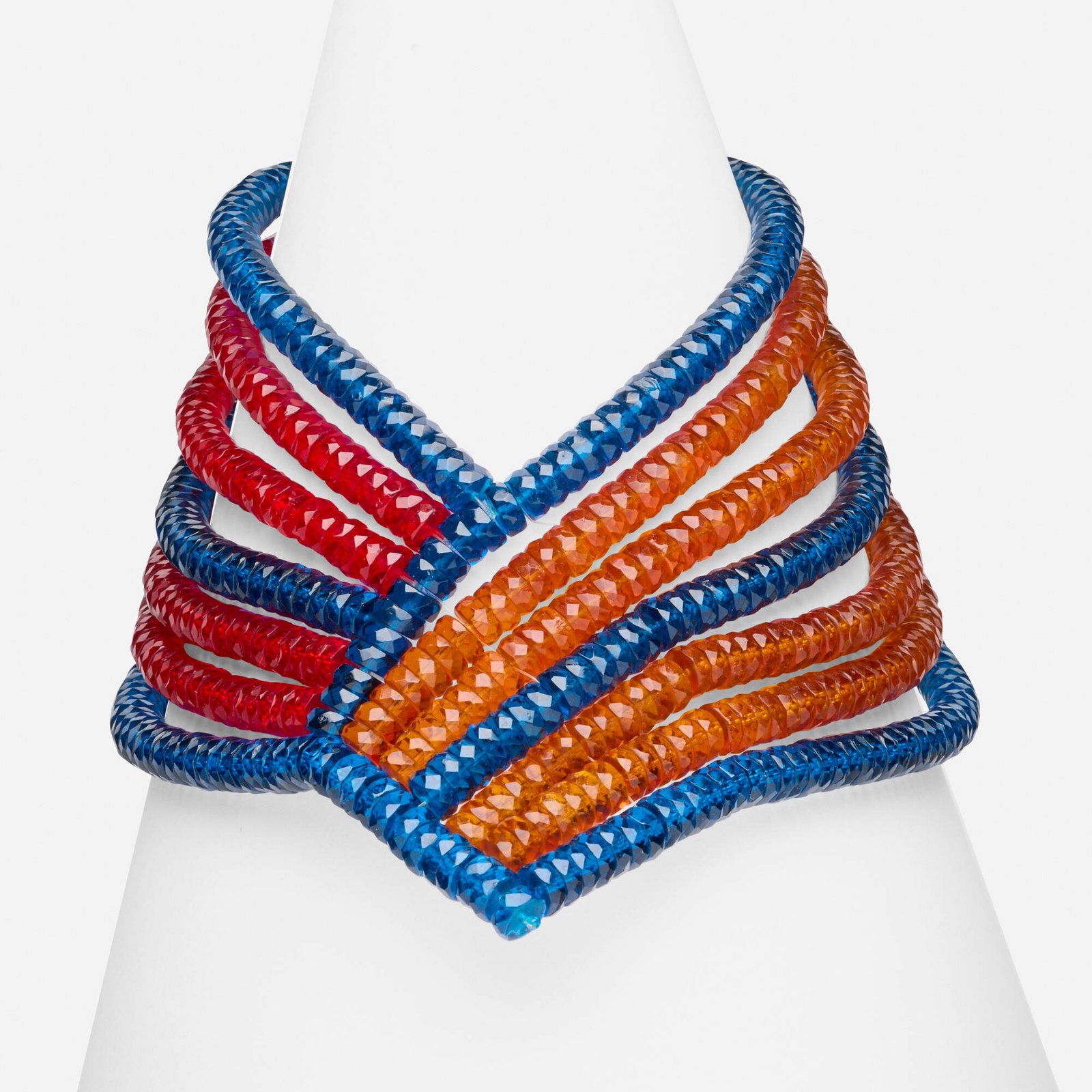 Glass and resin necklace: Glass and resin necklace Designed with strands of faceted blue, orange, and red beads, joined by a round resin clasp Base metal Approx. 15.50 in; Gross weight 336.3 dwts Provenance: Collection of Mari