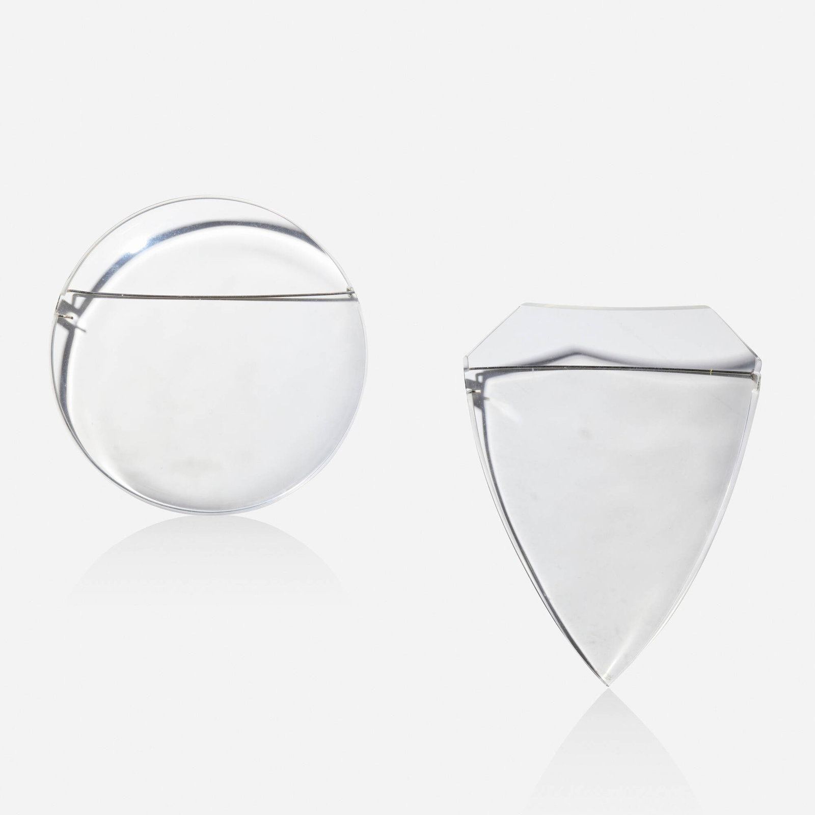 Alexander Blank, Two 'Shield' brooches: Alexander Blank Two 'Shield' brooches One a shield, the other a circle; 2007 Acrylic, base metal 4.25 x 3.25 in and 3.50 in; Gross weight 49.1 dwts Provenance: Collection of Mari Shaw