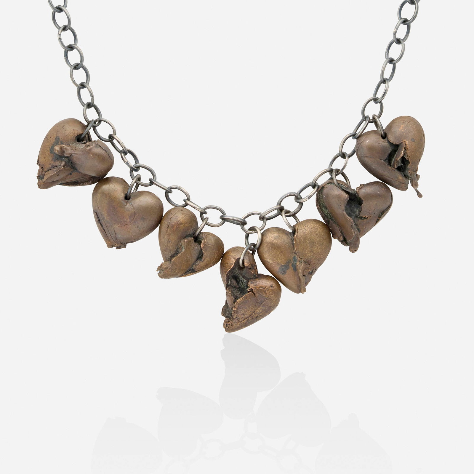 Florian Weichsberger, 'Hearts' bronze and silver necklace: Florian Weichsberger 'Hearts' bronze and silver necklace Designed with seven broken hearts suspended from the oval link chain; 2009 Bronze, silver Inner circ. approx. 26 in; Gross weight 406.8 dwts
