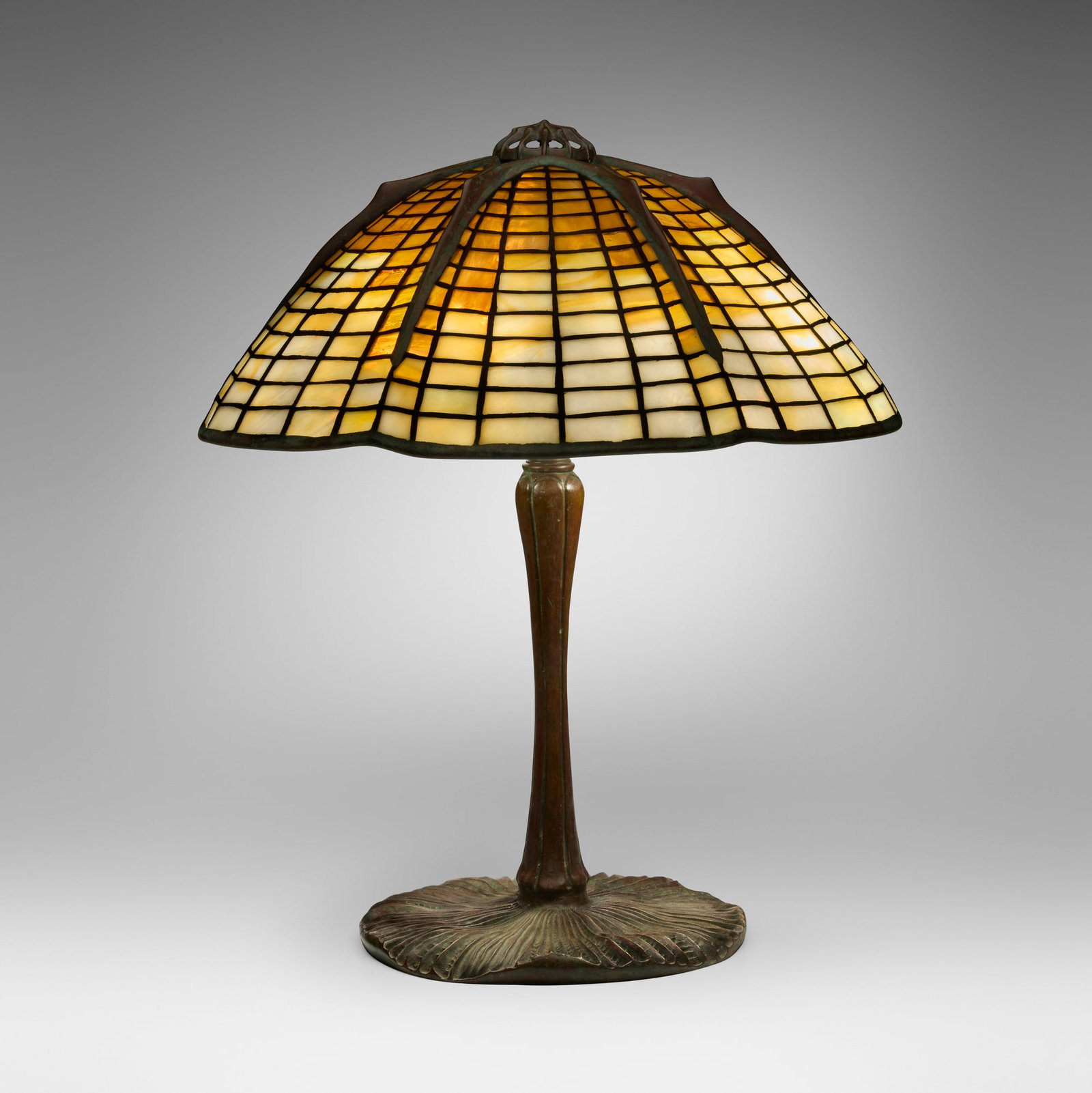 Tiffany Studios, Spider table lamp: Tiffany Studios Spider table lamp USA, c. 1910 leaded glass, patinated bronze 17.5 h x 15.25 dia in (44 x 39 cm) Lamp features a small standard Mushroom base. Impressed to shade '