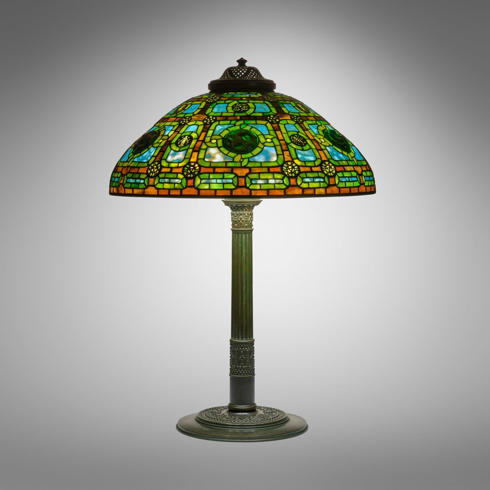 Tiffany Studios, Rare Zodiac table lamp: Tiffany Studios Rare Zodiac table lamp USA, c. 1910 leaded glass, Favrile glass, patinated bronze 31 h x 22 dia in (79 x 56 cm) Lamp features a Roman Library Standard base. Impresse