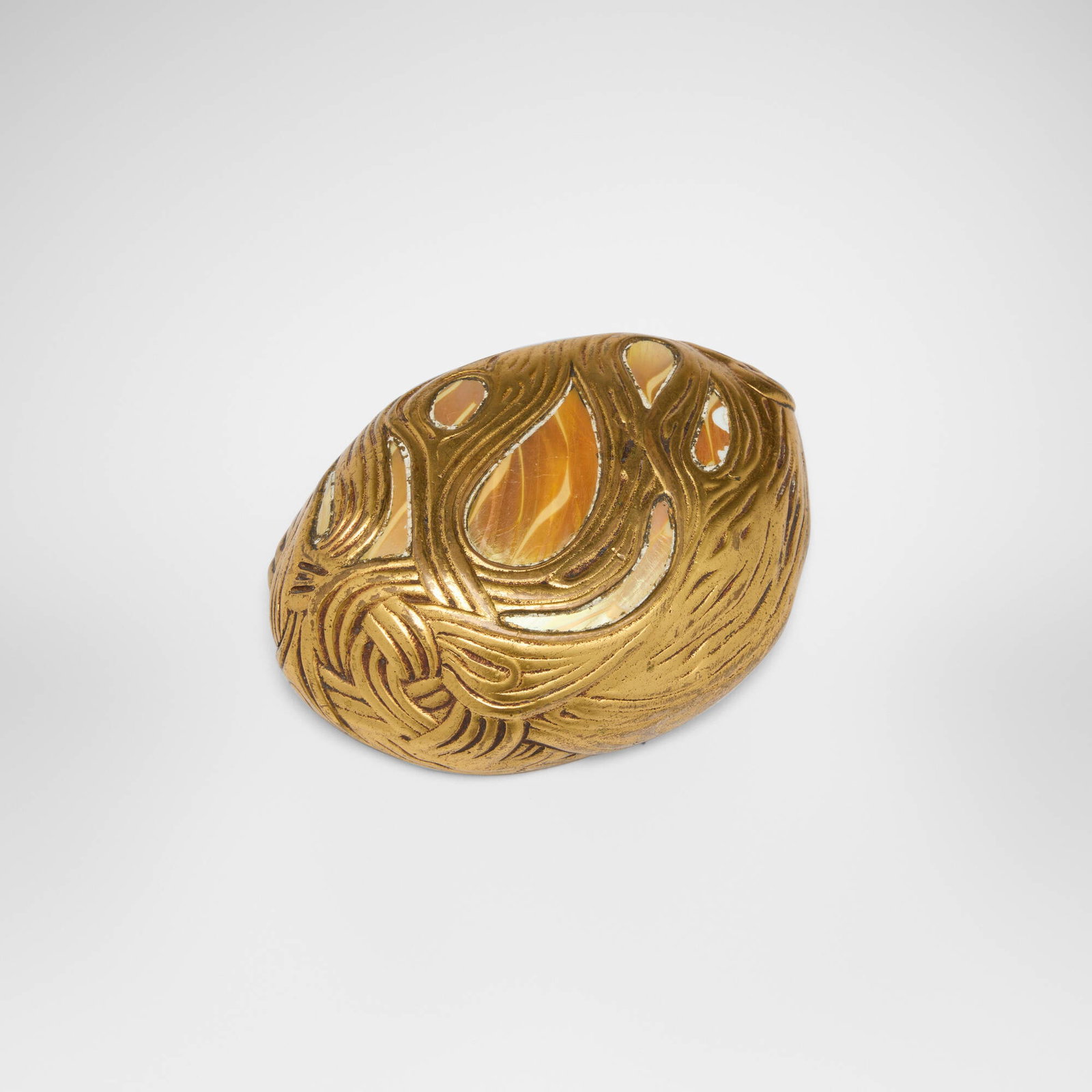 Tiffany Studios, Damascene Wave paperweight: Tiffany Studios Damascene Wave paperweight USA, c. 1910 gilt bronze, Favrile glass 1 h x 3.875 w x 2.75 d in (3 x 10 x 7 cm) Impressed to underside 'TIFFANY STUDIOS NEW YORK 932' with