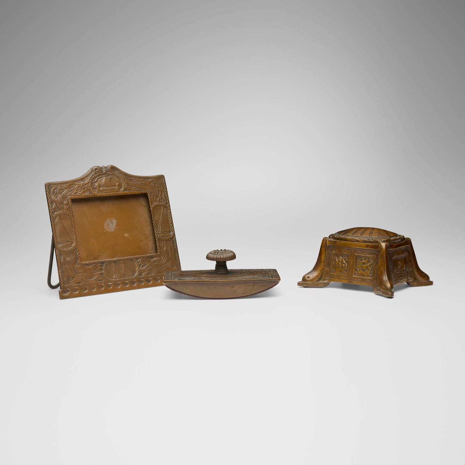 Tiffany Studios, Collection of three Nautical desk articles: Tiffany Studios Collection of three Nautical desk articles USA, c. 1920 patinated copper, glass 6 h x 6.75 w x 2.75 d in (15 x 17 x 7 cm) 2.75 h x 5.25 w x 4.25 d in (7 x 13 x 11 cm) 2 h x 5.375