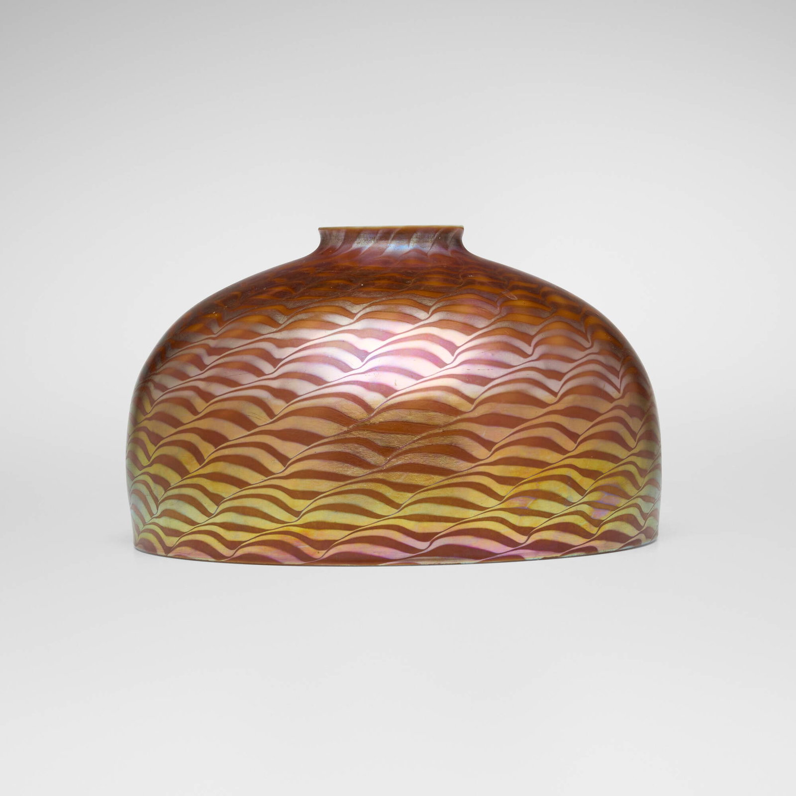 Tiffany Studios, Damascene shade: Tiffany Studios Damascene shade USA, c. 1910 hand-blown Favrile glass 4.5 h x 7.5 dia in (11 x 19 cm) Etched to interior of fitter rim 'L.C.T. Favrile'. This work will ship from