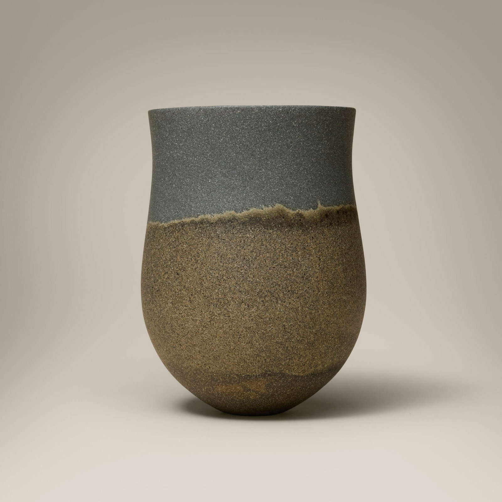Jennifer Lee, Dark base, haloed speckled band, slate blue top: Jennifer Lee Dark base, haloed speckled band, slate blue top 1998 hand-built colored stoneware with oxides 7.25 h x 5.5 dia in (18 x 14 cm) Signed to underside 'JL'. This work is registered