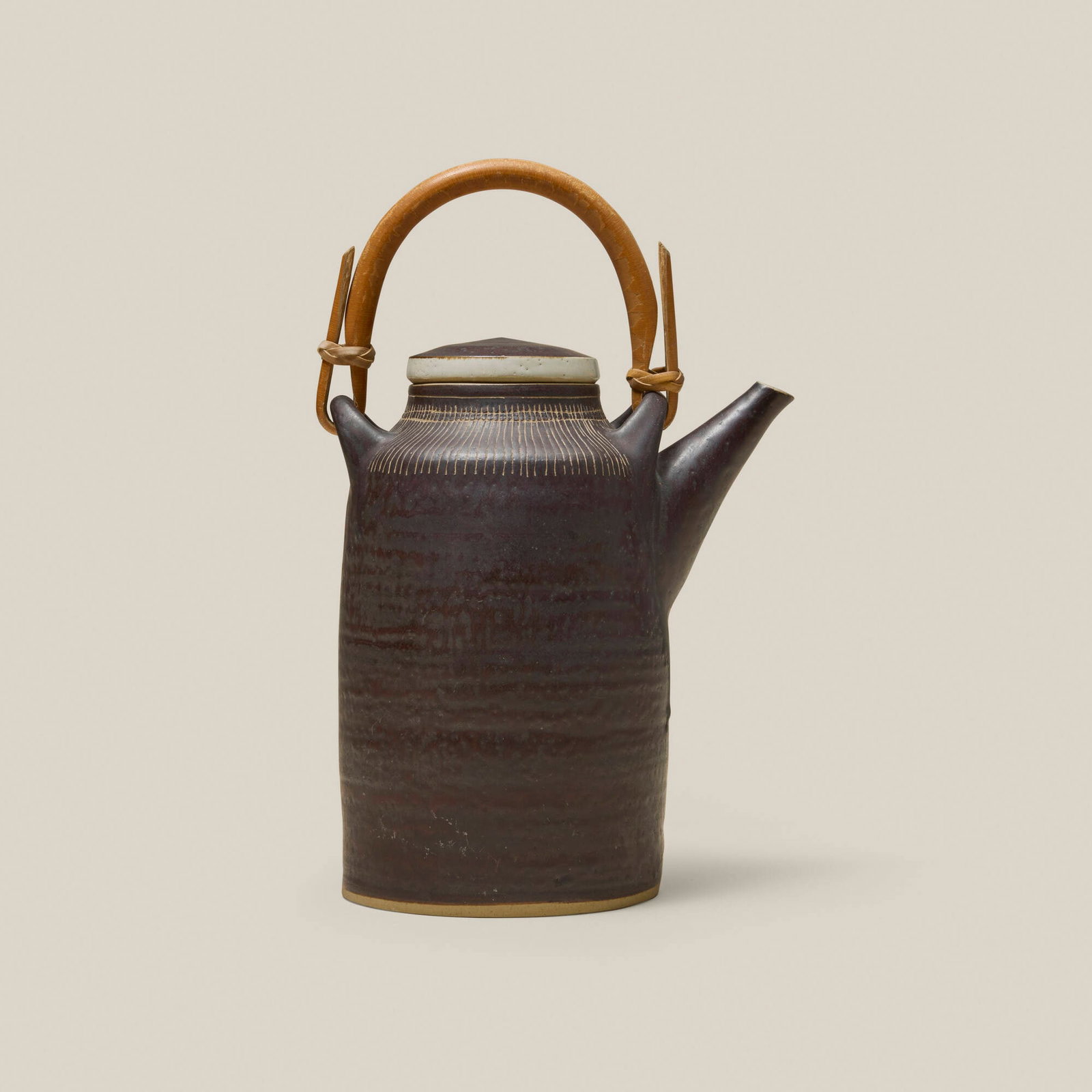 Lucie Rie, Teapot: Lucie Rie Teapot c. 1960 glazed stoneware, bamboo 9.5 h x 6.5 w x 4.375 d in (24 x 17 x 11 cm) Impressed artist's seal to underside. Provenance: Gift from Dena and