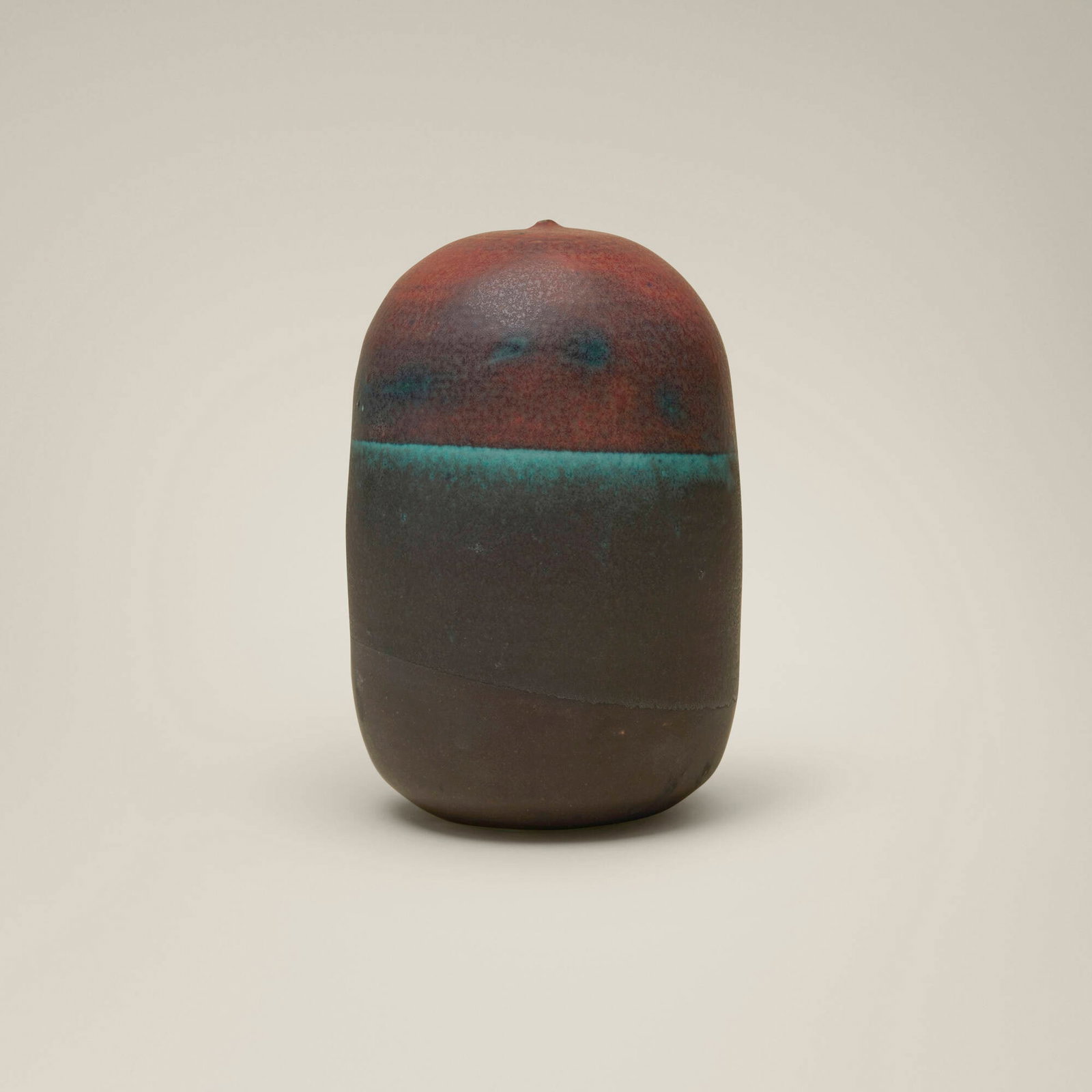 Toshiko Takaezu, Ocean-Edge Closed Form (with rattle): Toshiko Takaezu Ocean-Edge Closed Form (with rattle) 1994 glazed porcelain 7.25 h x 5 dia in (18 x 13 cm) Incised signature to underside 'TT'. Provenance: Gift
