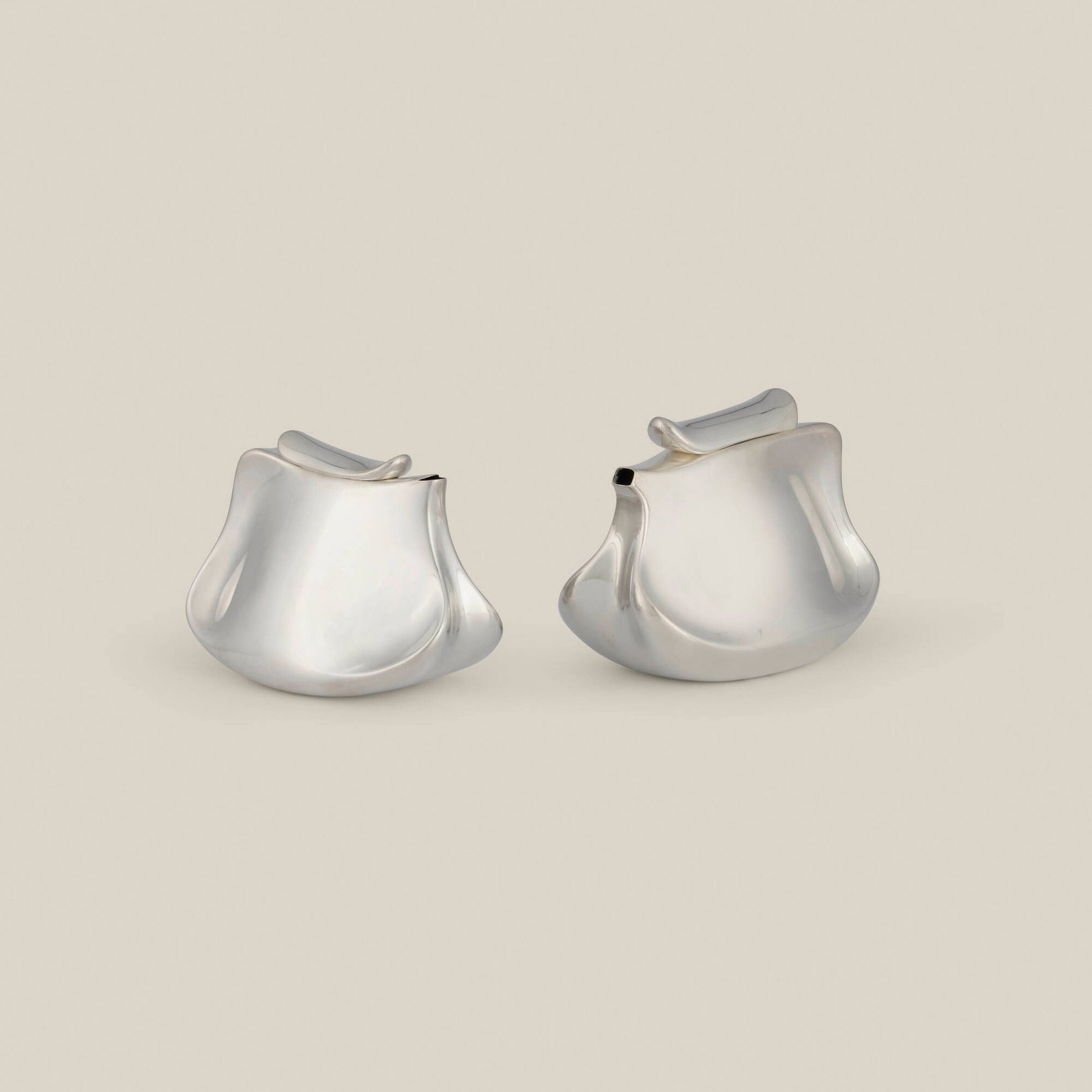 Chunghi Choo, Decanters, set of two: Chunghi Choo Decanters, set of two c. 1980 silver-plated and electroformed copper 6.5 h x 8.25 w x 4.875 d in (17 x 21 x 12 cm) 5.75 h x 8 w x 4.5 d in (15 x 20 x 11 cm) Related examples are