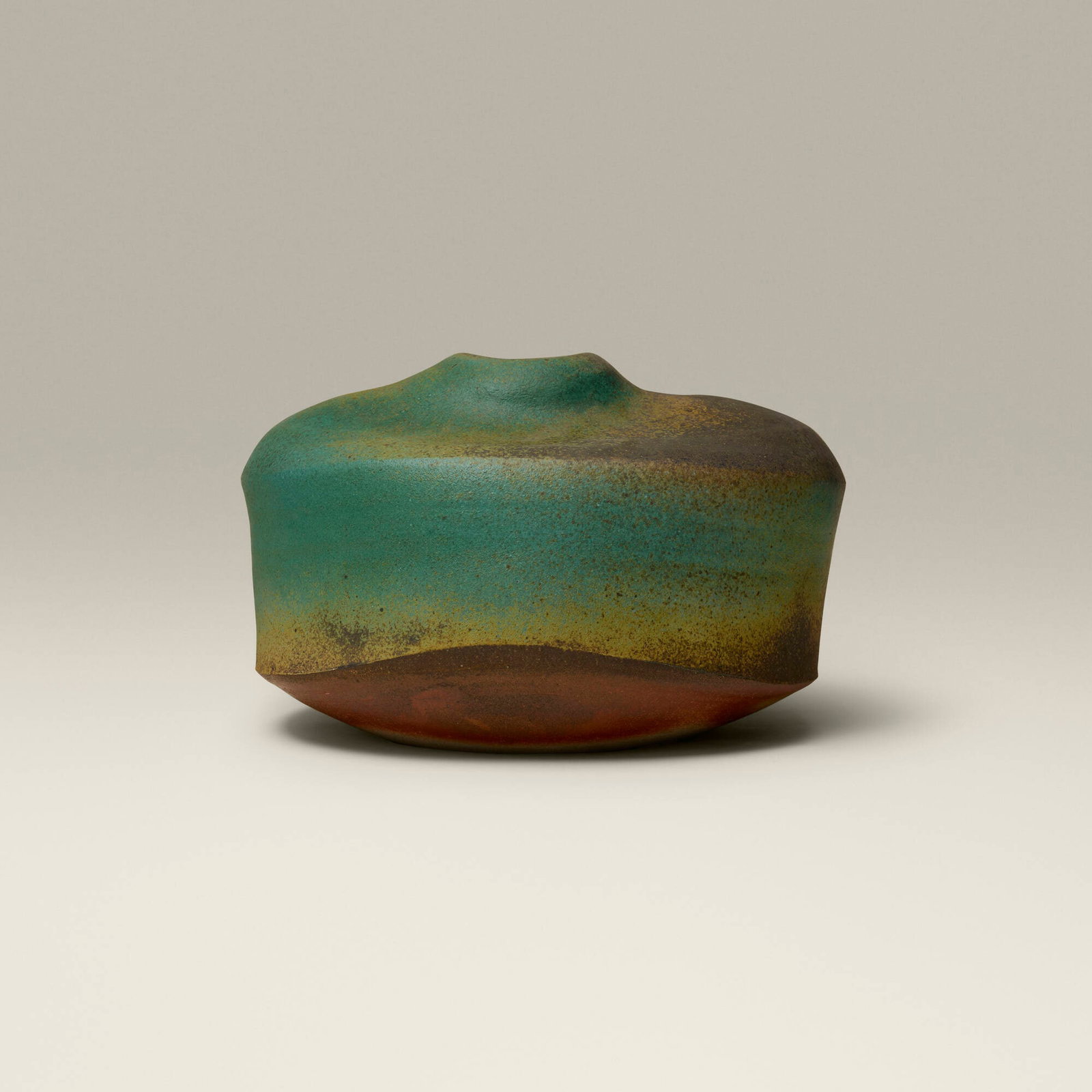 Karen Karnes, Vessel: Karen Karnes Vessel c. 1990 salt-glazed and wood-fired stoneware 10.125 h x 16.375 w x 14.375 d in (26 x 42 x 37 cm) Impressed artist's chop mark near base 'KK'. Provenance: Gift from Dena and