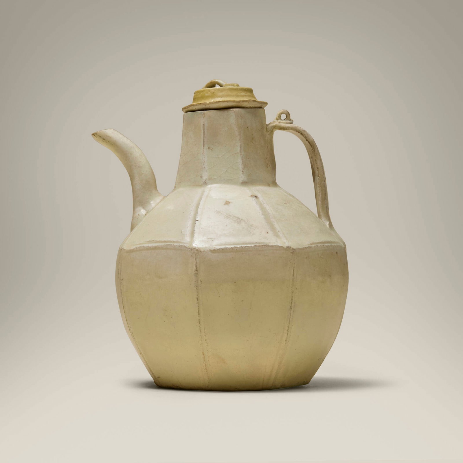 Chinese, Ding Yao faceted ewer with cover: Chinese Ding Yao faceted ewer with cover 19th century or earlier glazed porcelain 6.75 h x 5.5 w x 5.125 d in (17 x 14 x 13 cm) Provenance: Collection of Jack Lenor Larsen This work will ship from