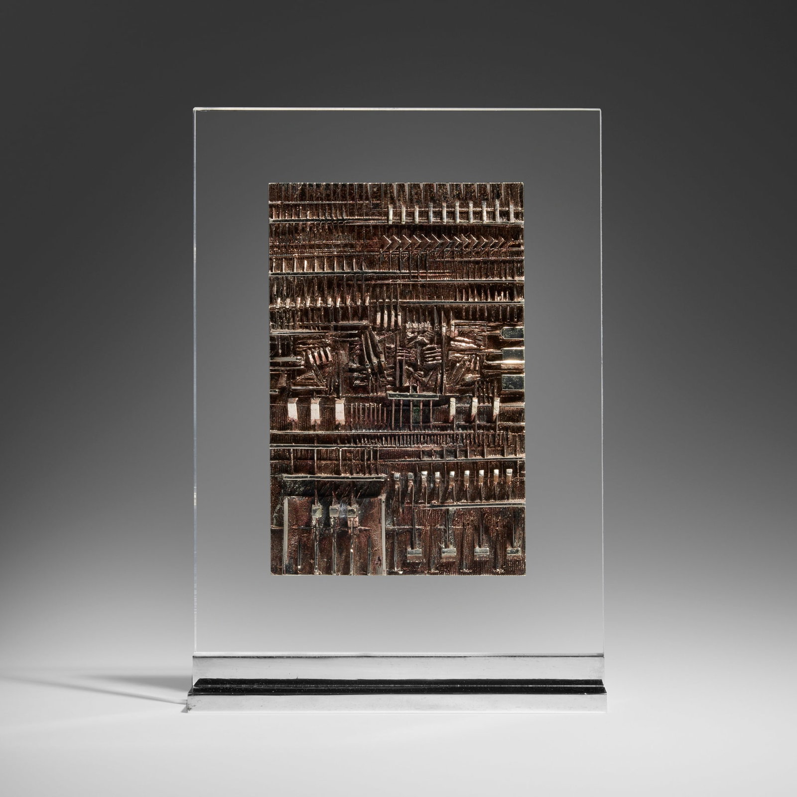 Arnaldo Pomodoro, Rilievo: Arnaldo Pomodoro Rilievo c. 1979 silvered bronze, plexiglass, chrome-plated brass 11.75 h x 8.125 w x 2.375 d in (30 x 21 x 6 cm) This work is number 5 from the edition of 9 and is catalogued w