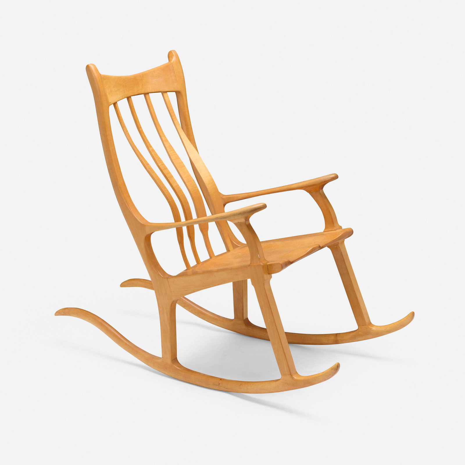 John Wesley Williams, Rocking chair: John Wesley Williams Rocking chair USA, c. 1980 maple 44.5 h x 23 w x 53 d in (113 x 58 x 135 cm) Branded signature to underside 'Handcrafted by John Wesley Williams'. Provenance: